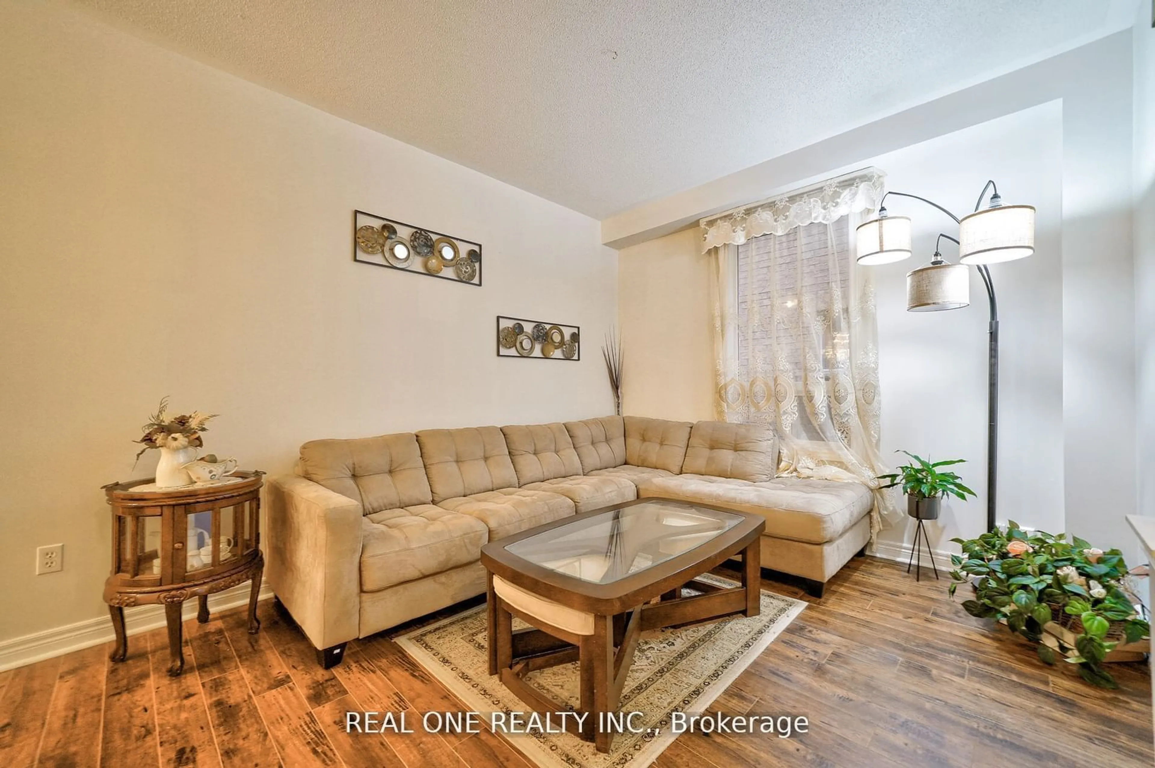 Living room with furniture, wood/laminate floor for 41 Timbercreek Crt, Toronto Ontario M1W 4A1