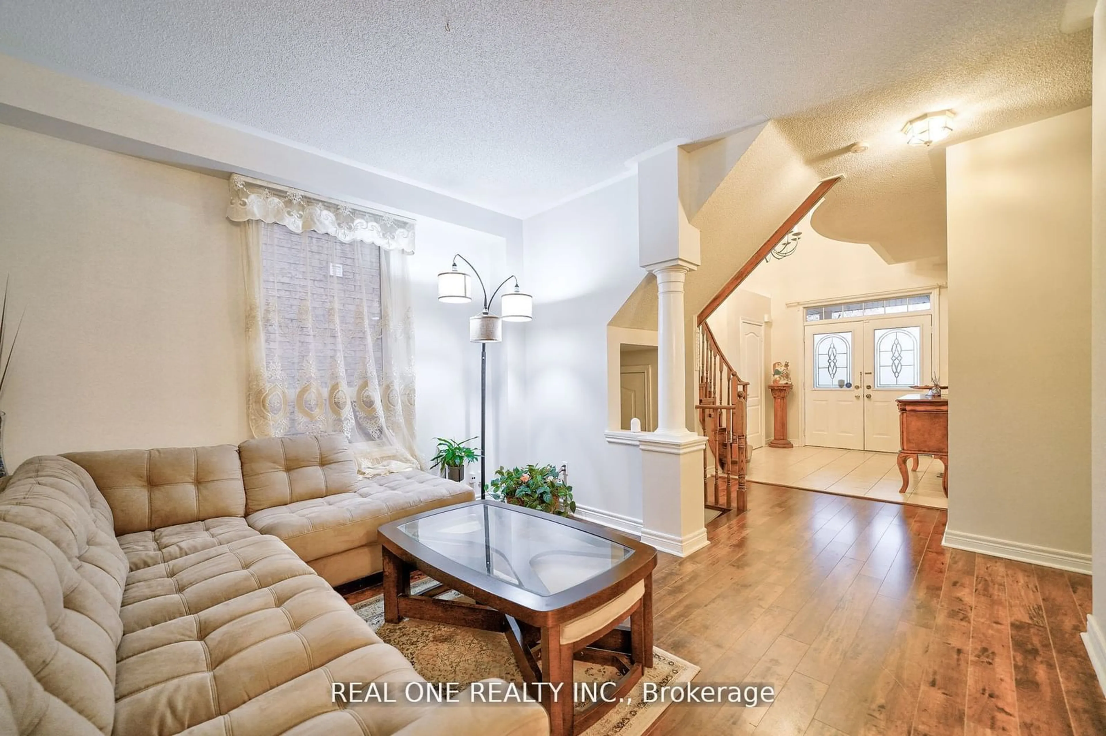 Living room with furniture, wood/laminate floor for 41 Timbercreek Crt, Toronto Ontario M1W 4A1