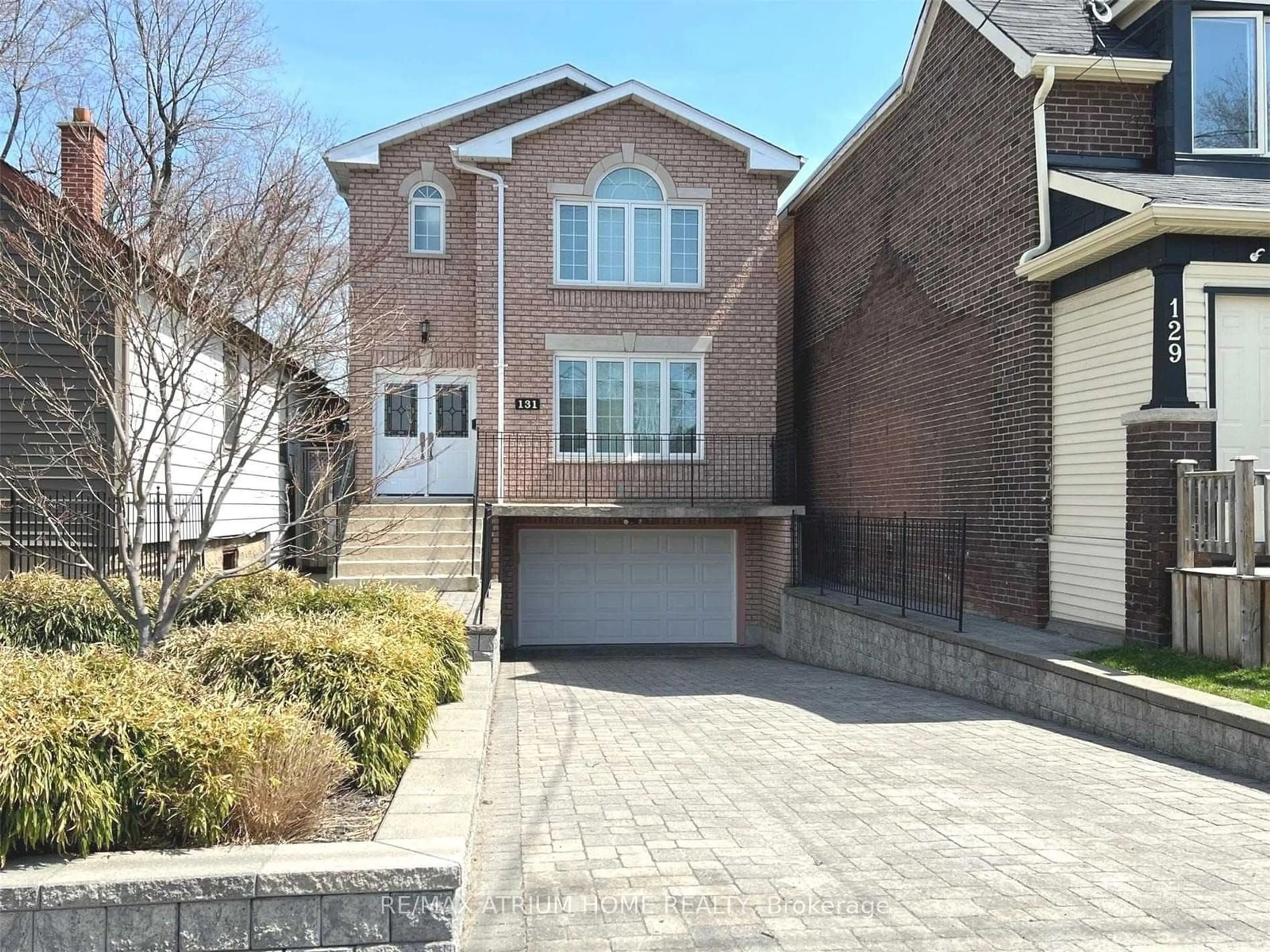 Home with brick exterior material, street for 131 Cedarvale Ave, Toronto Ontario M4C 4J9