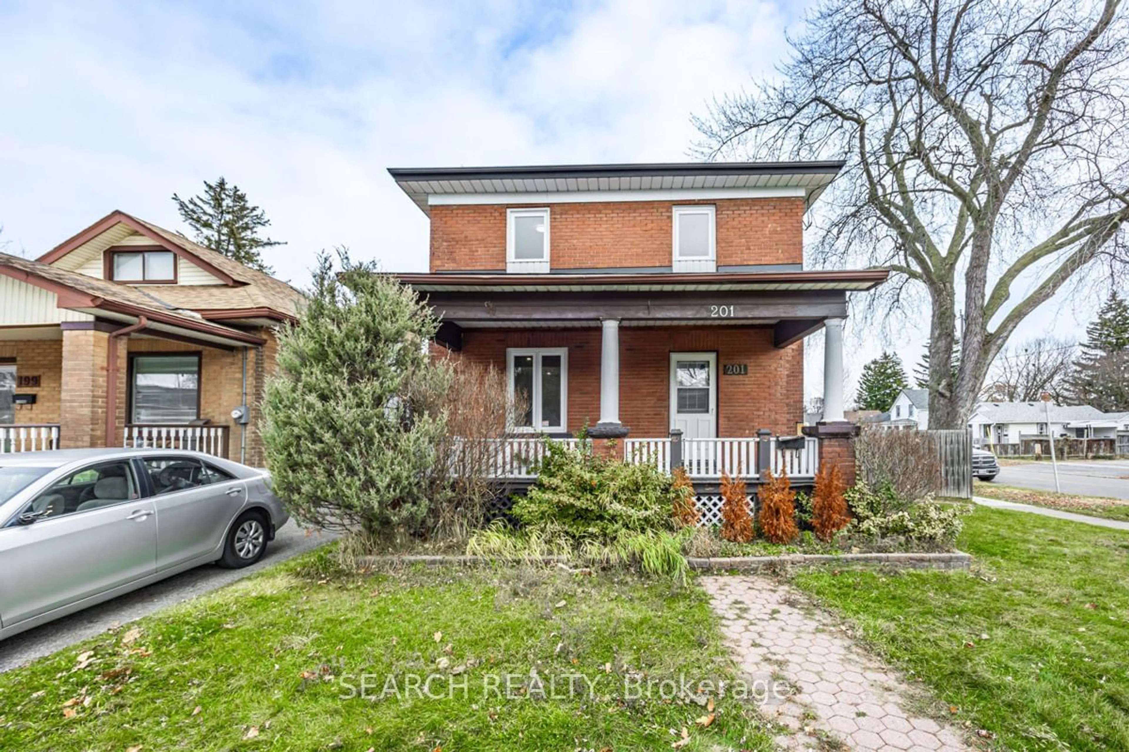 Home with brick exterior material, street for 201 Ritson Rd, Oshawa Ontario L1H 5H6