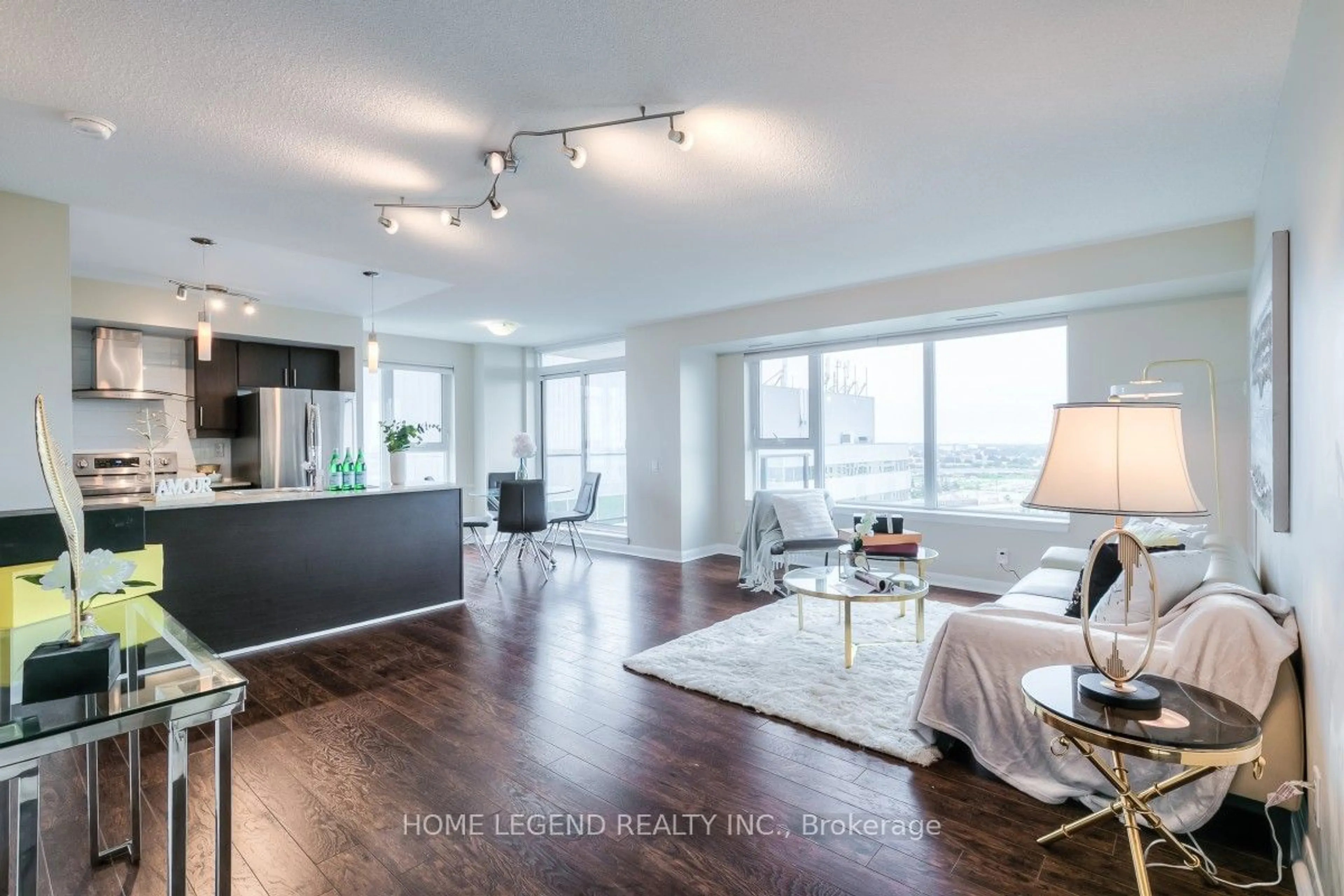 Living room with furniture, wood/laminate floor for 25 Town Centre Crt #1502, Toronto Ontario M1P 0B4