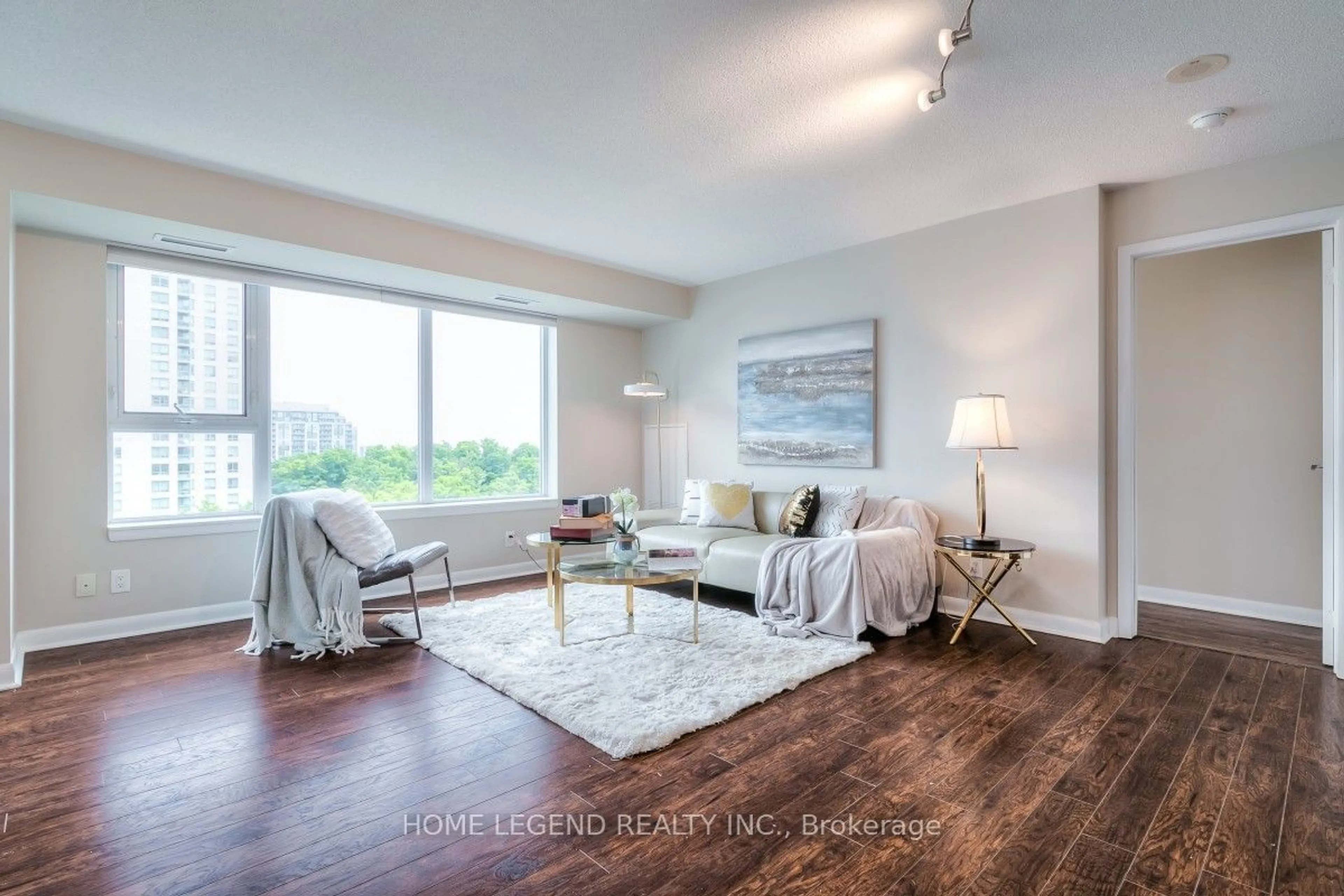 Living room with furniture, wood/laminate floor for 25 Town Centre Crt #1502, Toronto Ontario M1P 0B4