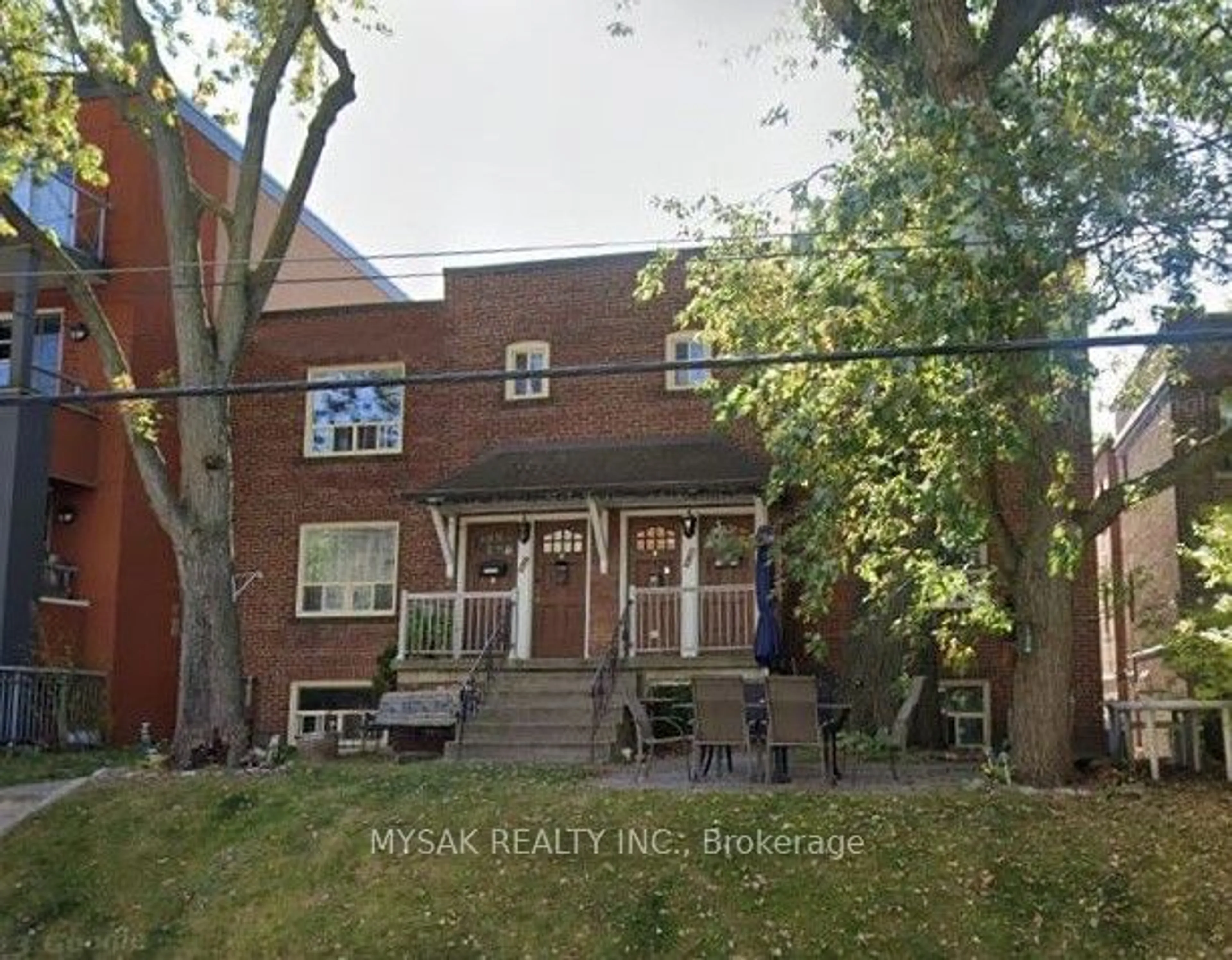 Home with brick exterior material, street for 2369 Queen St, Toronto Ontario M4E 1H2