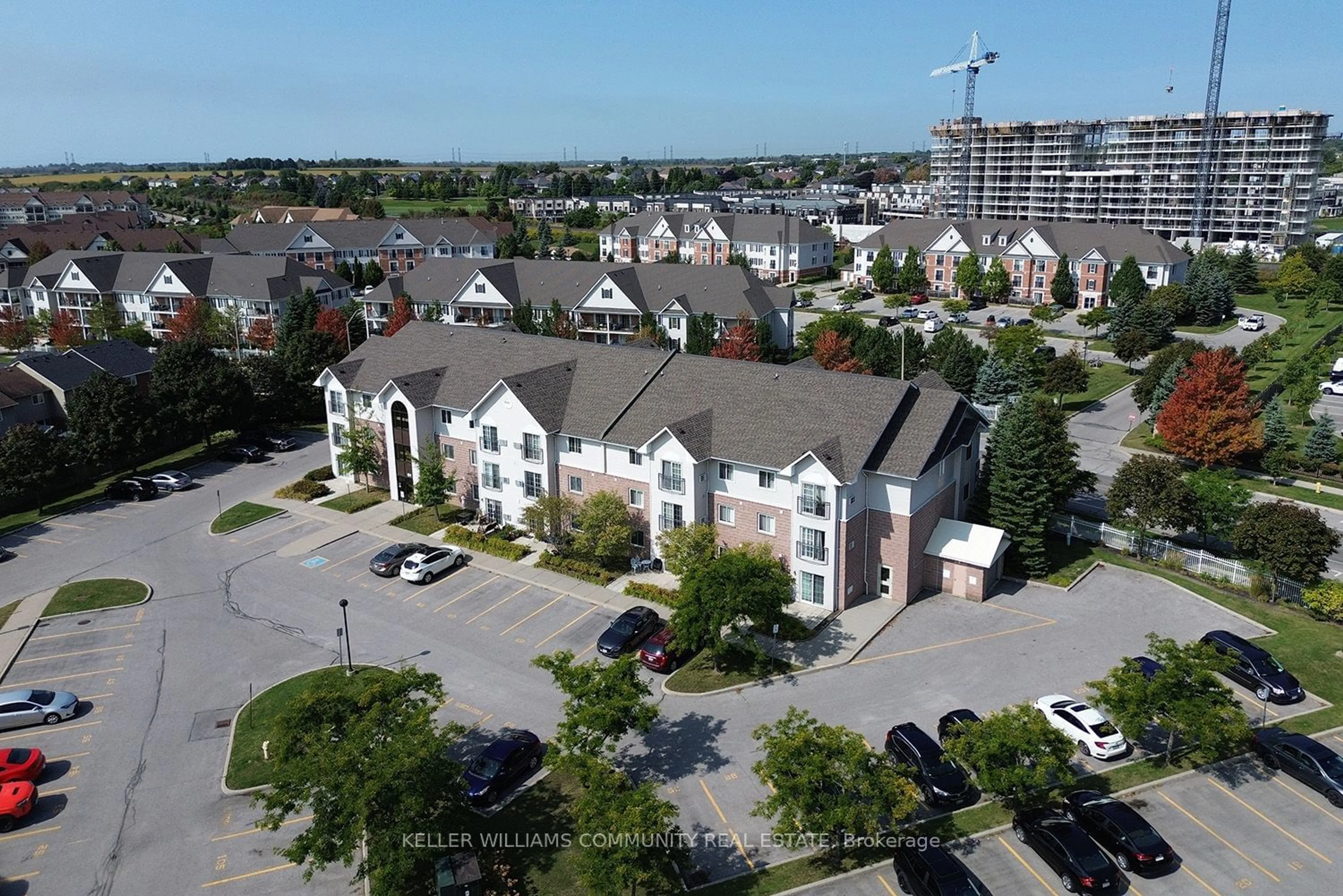 A pic from outside/outdoor area/front of a property/back of a property/a pic from drone, city buildings view from balcony for 91 Aspen Springs Dr #301, Clarington Ontario L1C 5J9