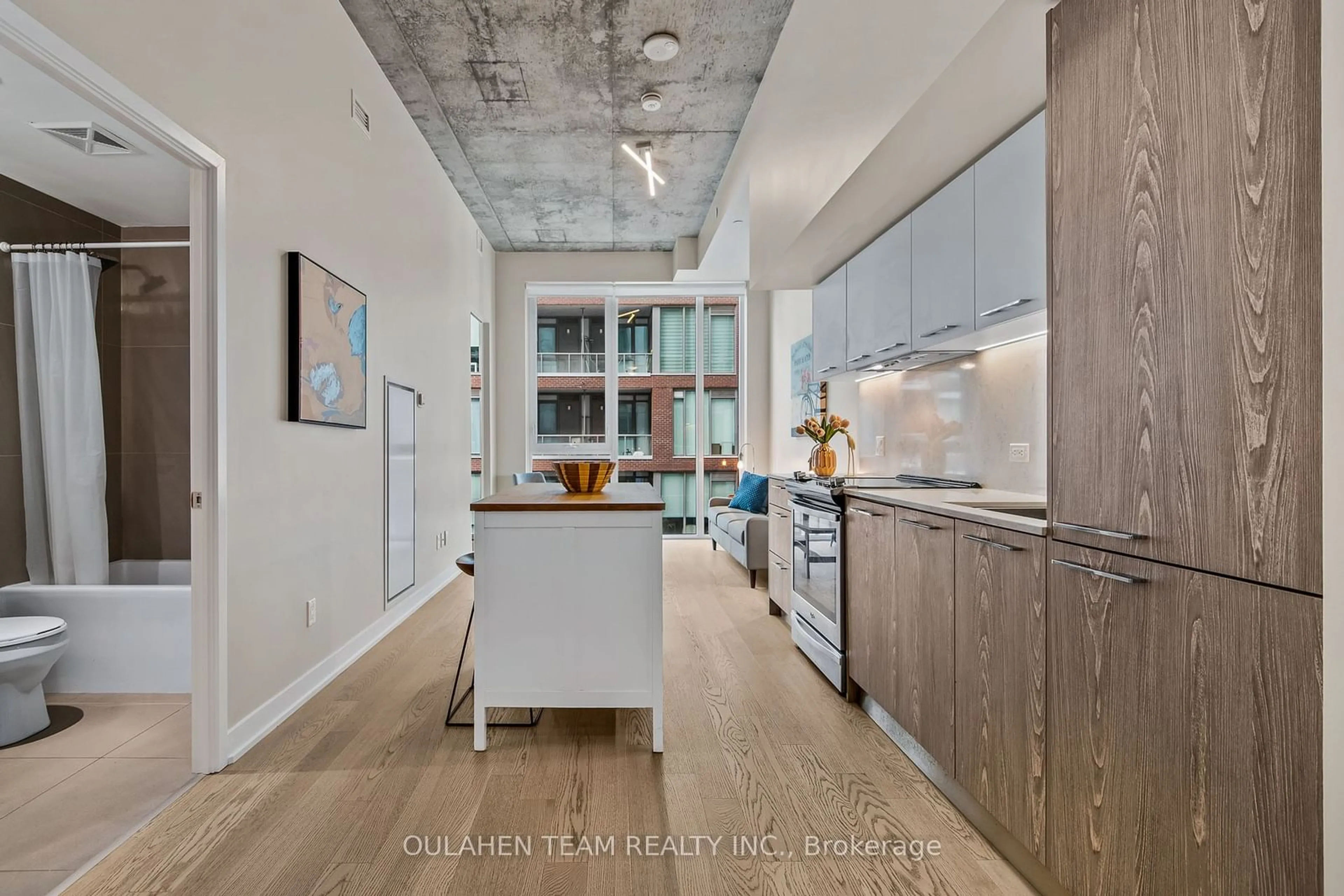 Open concept kitchen, cement floor for 15 Baseball Pl #516, Toronto Ontario M4M 0E6