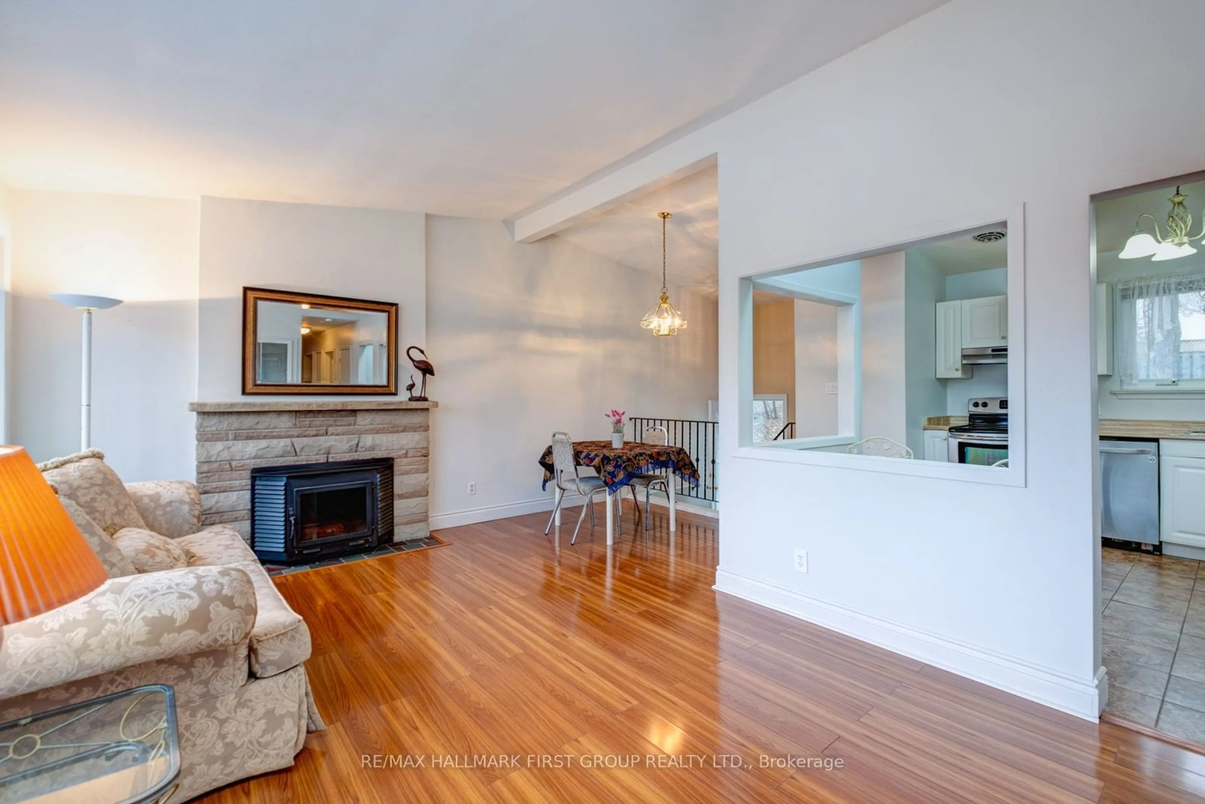 Living room with furniture, wood/laminate floor for 432 Rouge Highlands Dr, Toronto Ontario M1C 2V8