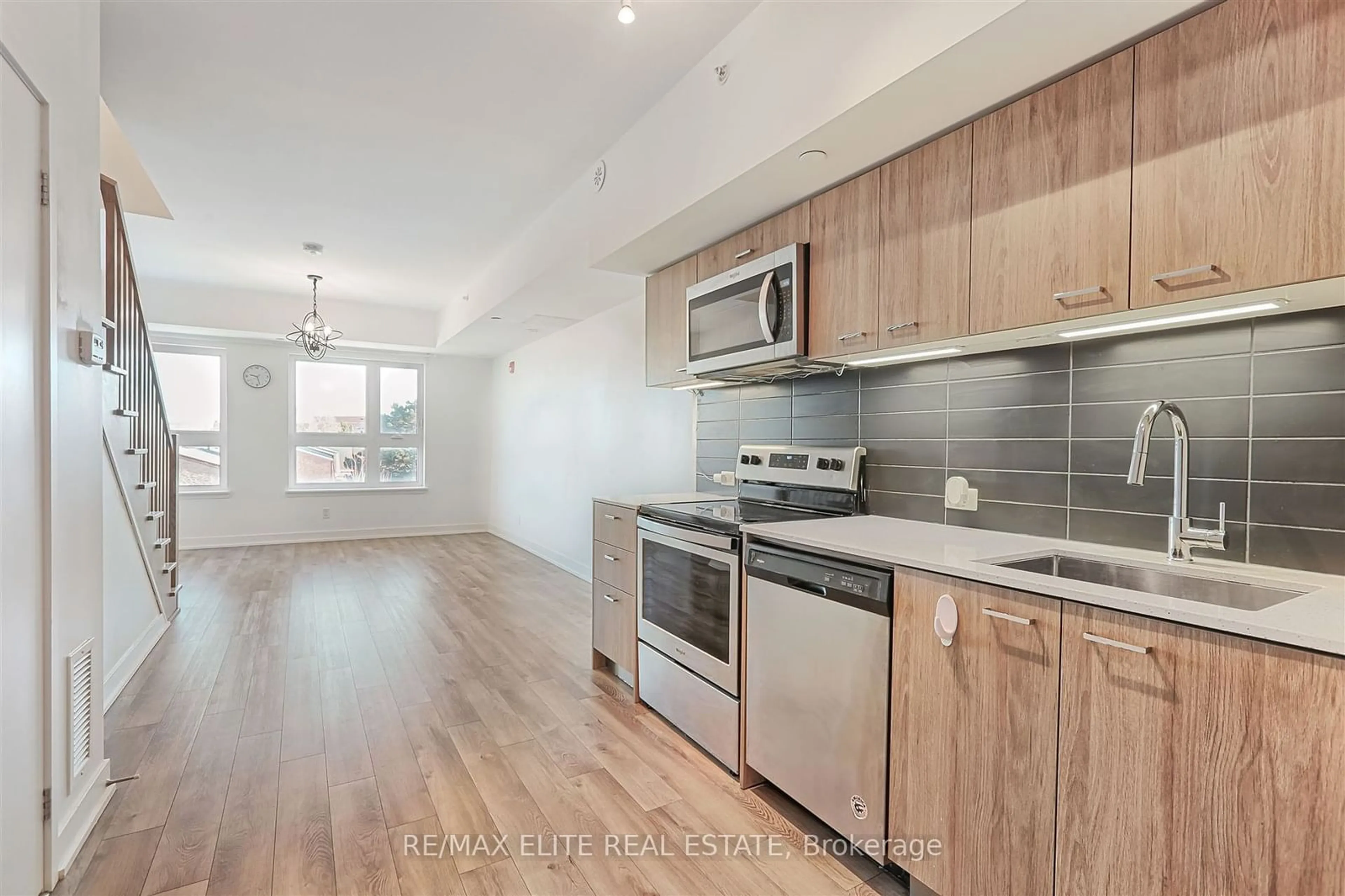 Open concept kitchen, wood/laminate floor for 2100 Bridletowne Circ #309, Toronto Ontario M1W 0A6