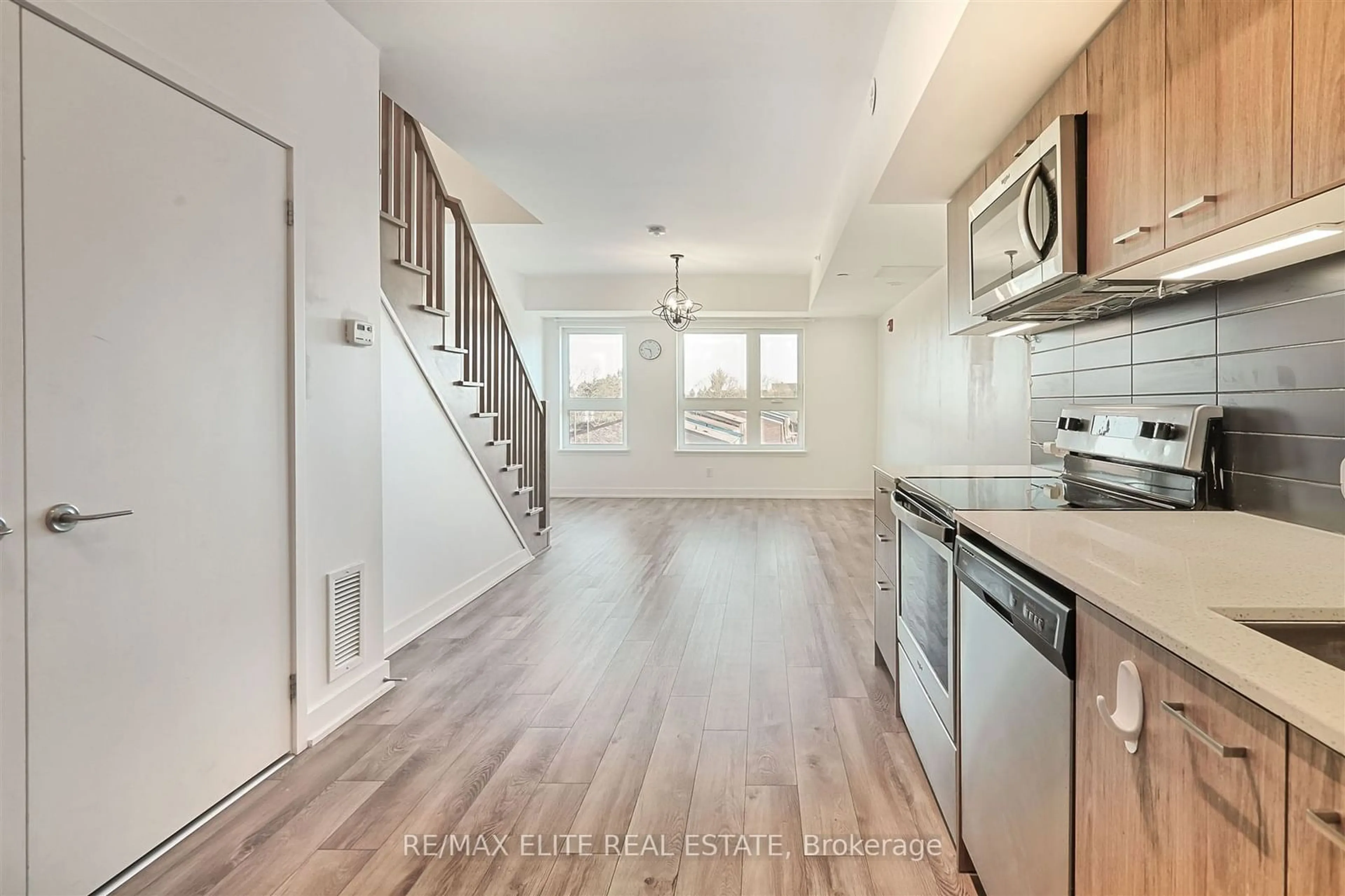 Open concept kitchen, wood/laminate floor for 2100 Bridletowne Circ #309, Toronto Ontario M1W 0A6