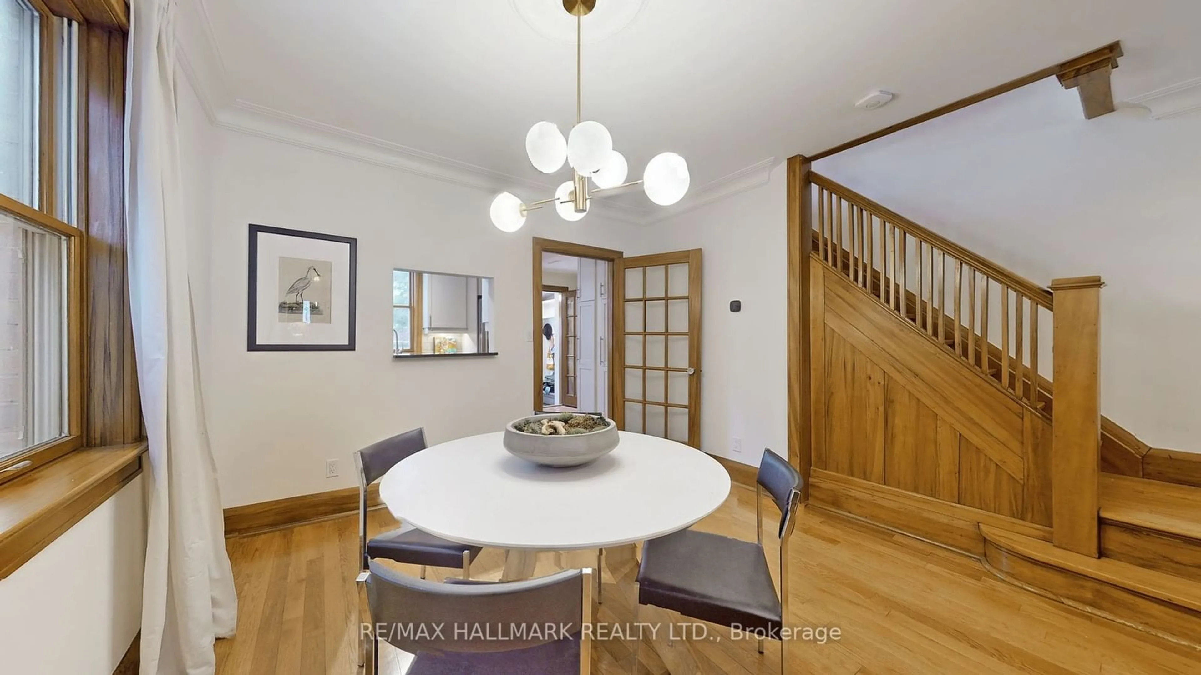 Dining room, wood/laminate floor for 135 Woodycrest Ave, Toronto Ontario M4J 3B7