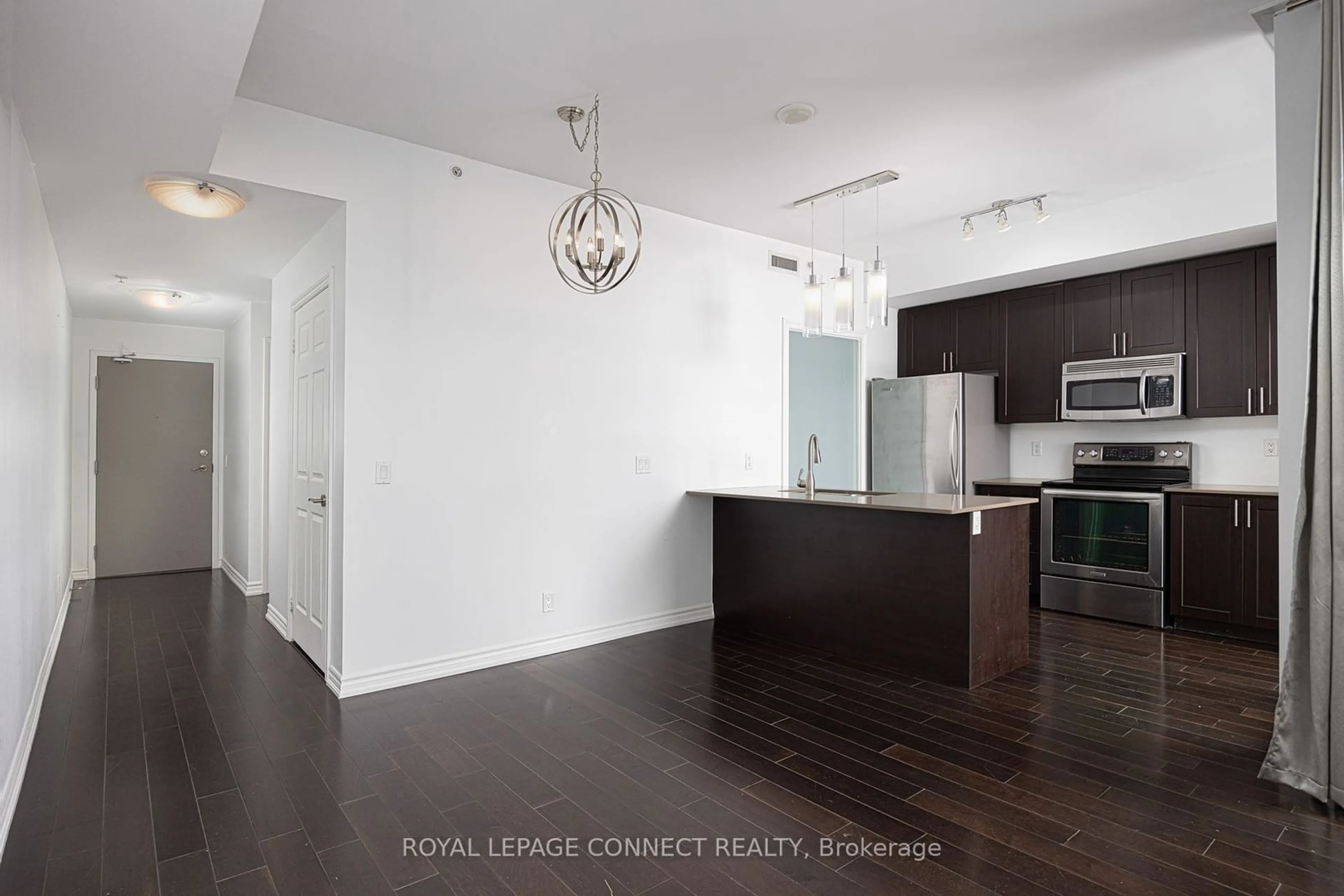 Open concept kitchen, wood/laminate floor for 280 Donlands Ave #910, Toronto Ontario M4J 0A3