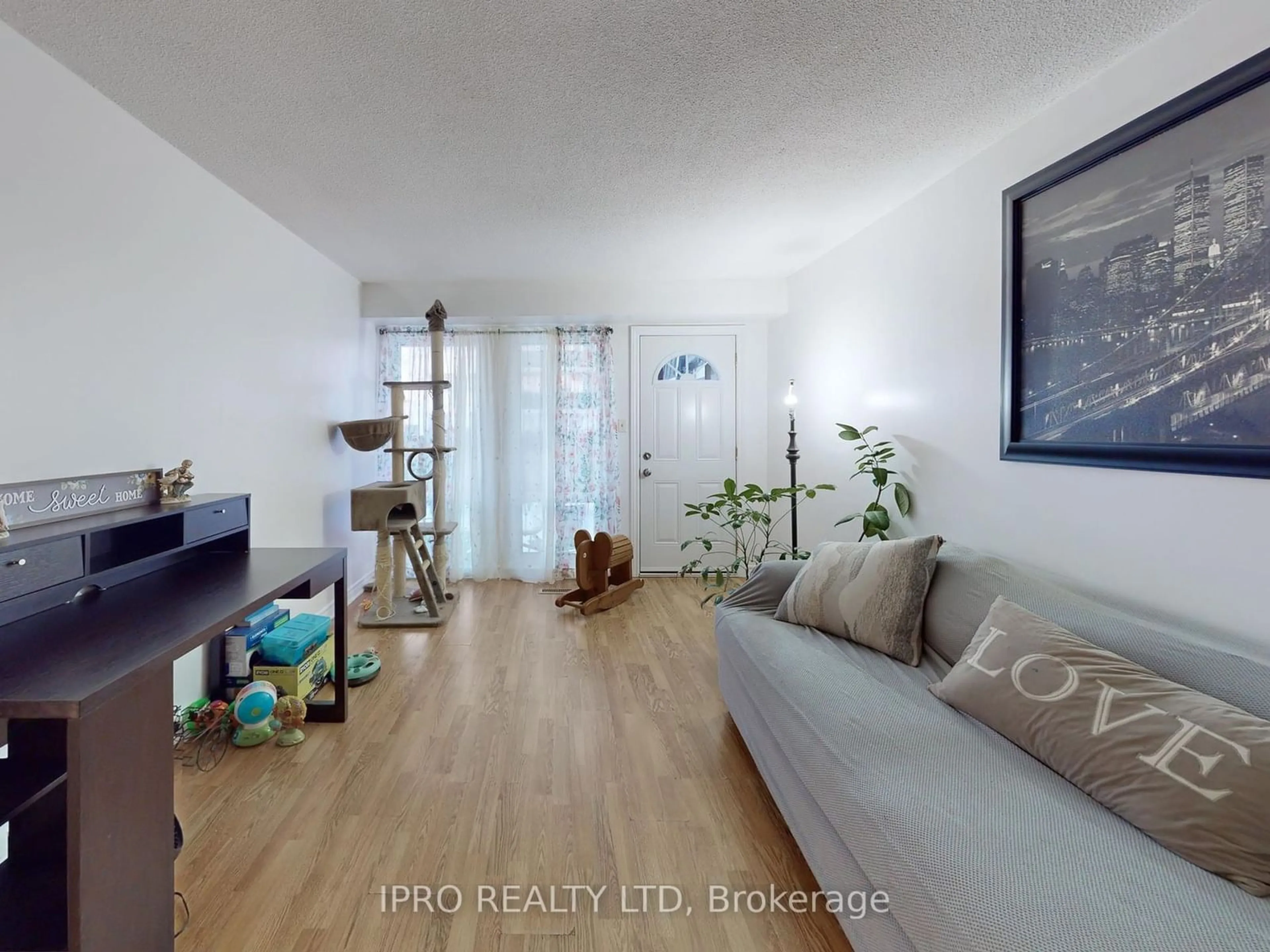 Living room with furniture, wood/laminate floor for 1333 Mary St #87, Oshawa Ontario L1G 6Z3