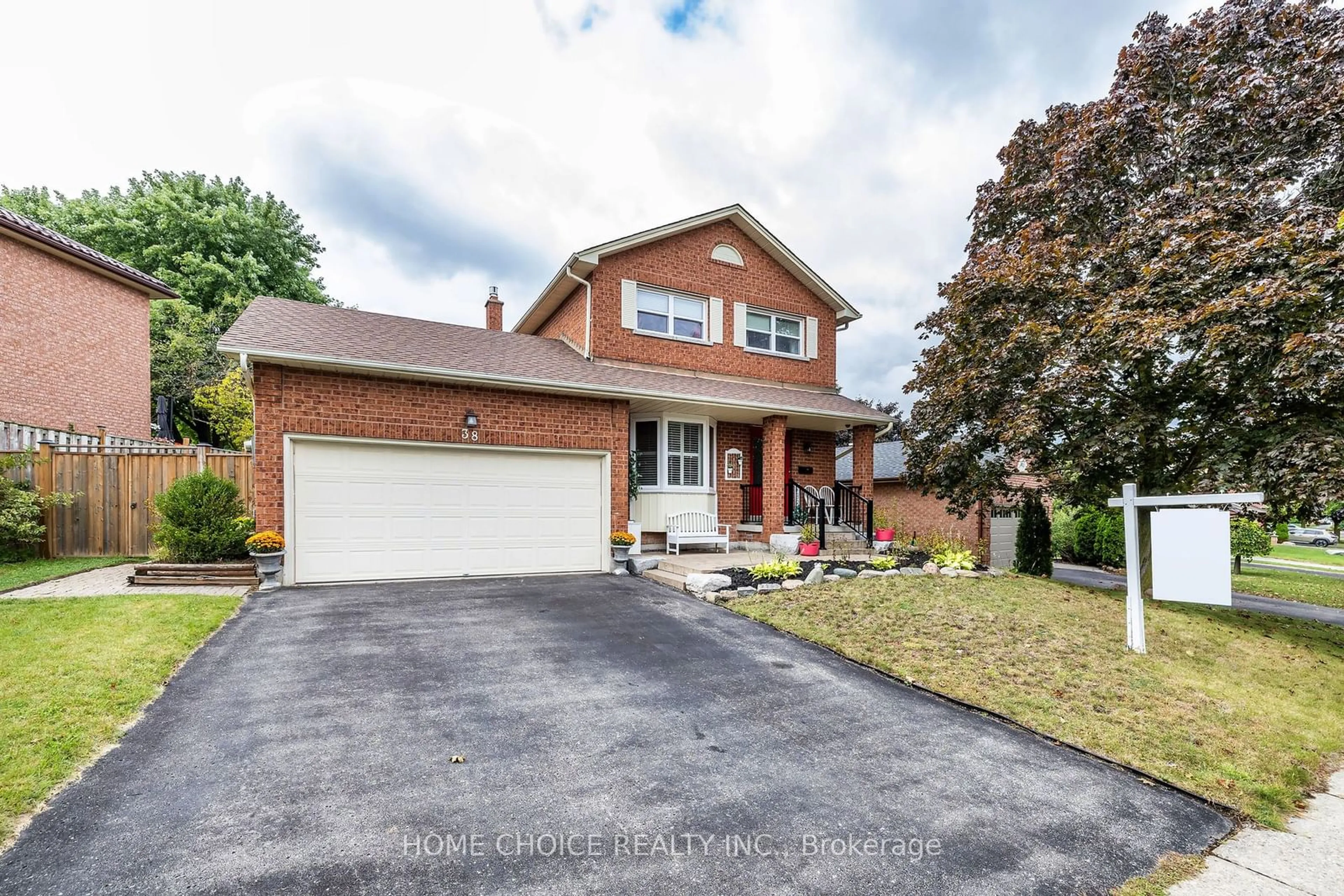 Home with brick exterior material, street for 38 Canadian Oaks Dr, Whitby Ontario L1N 6W8