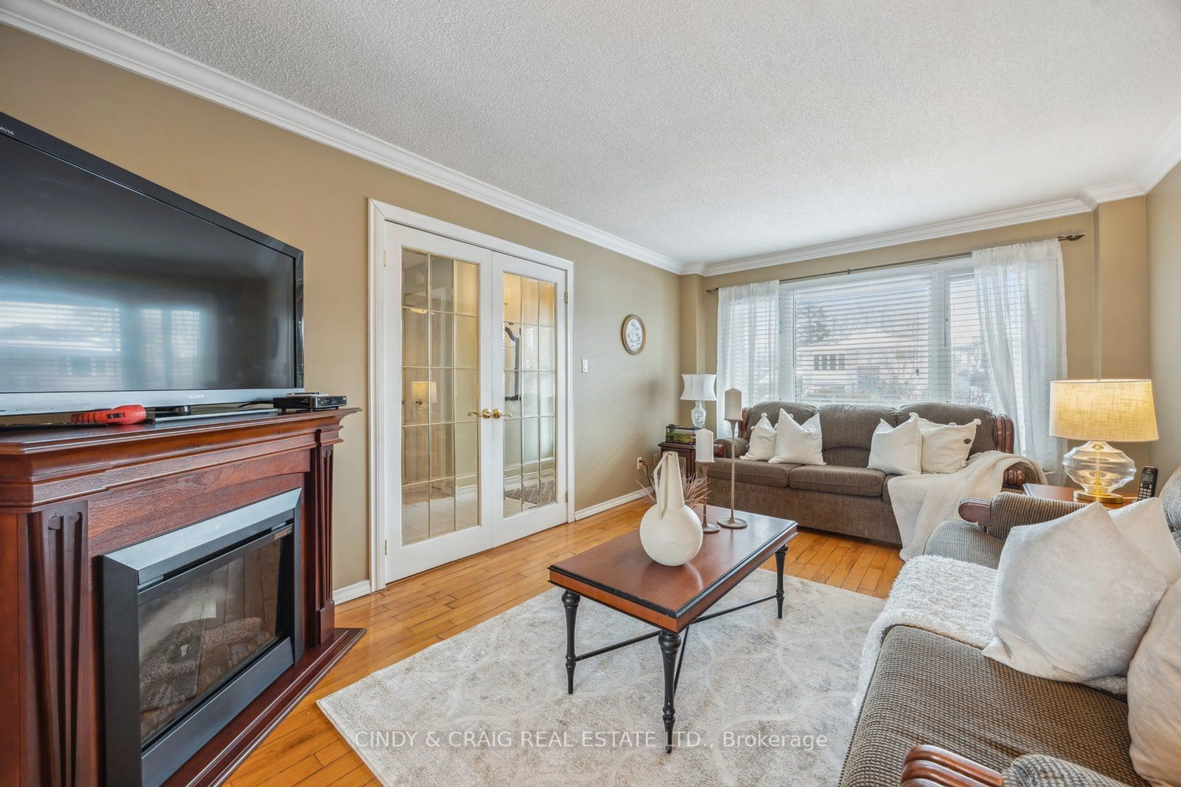 Living room with furniture, wood/laminate floor for 840 Charisma Cres, Oshawa Ontario L1J 7S8