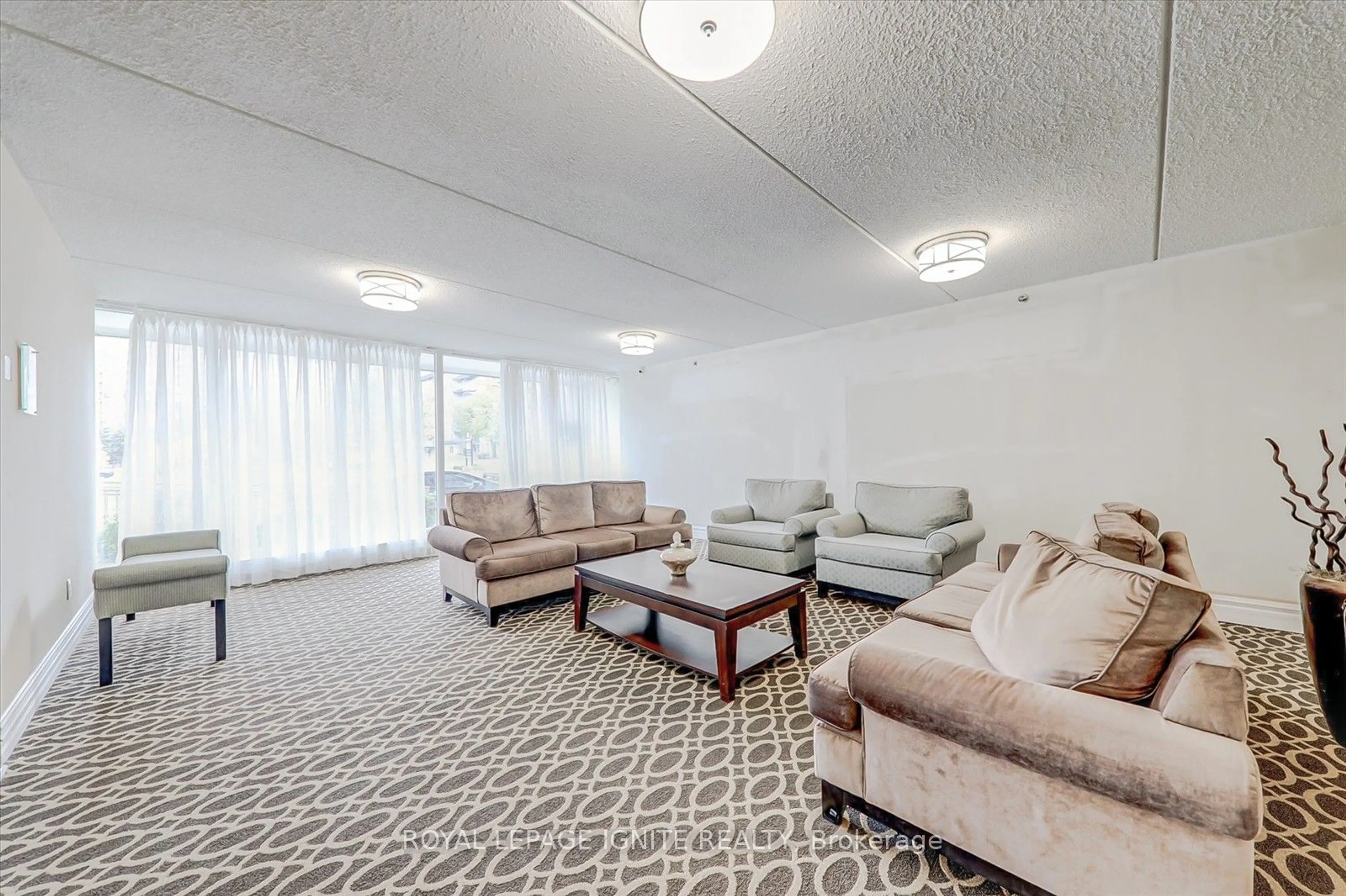 Living room with furniture, carpet floor for 2 Glamorgan Ave #103, Toronto Ontario M1P 2M8