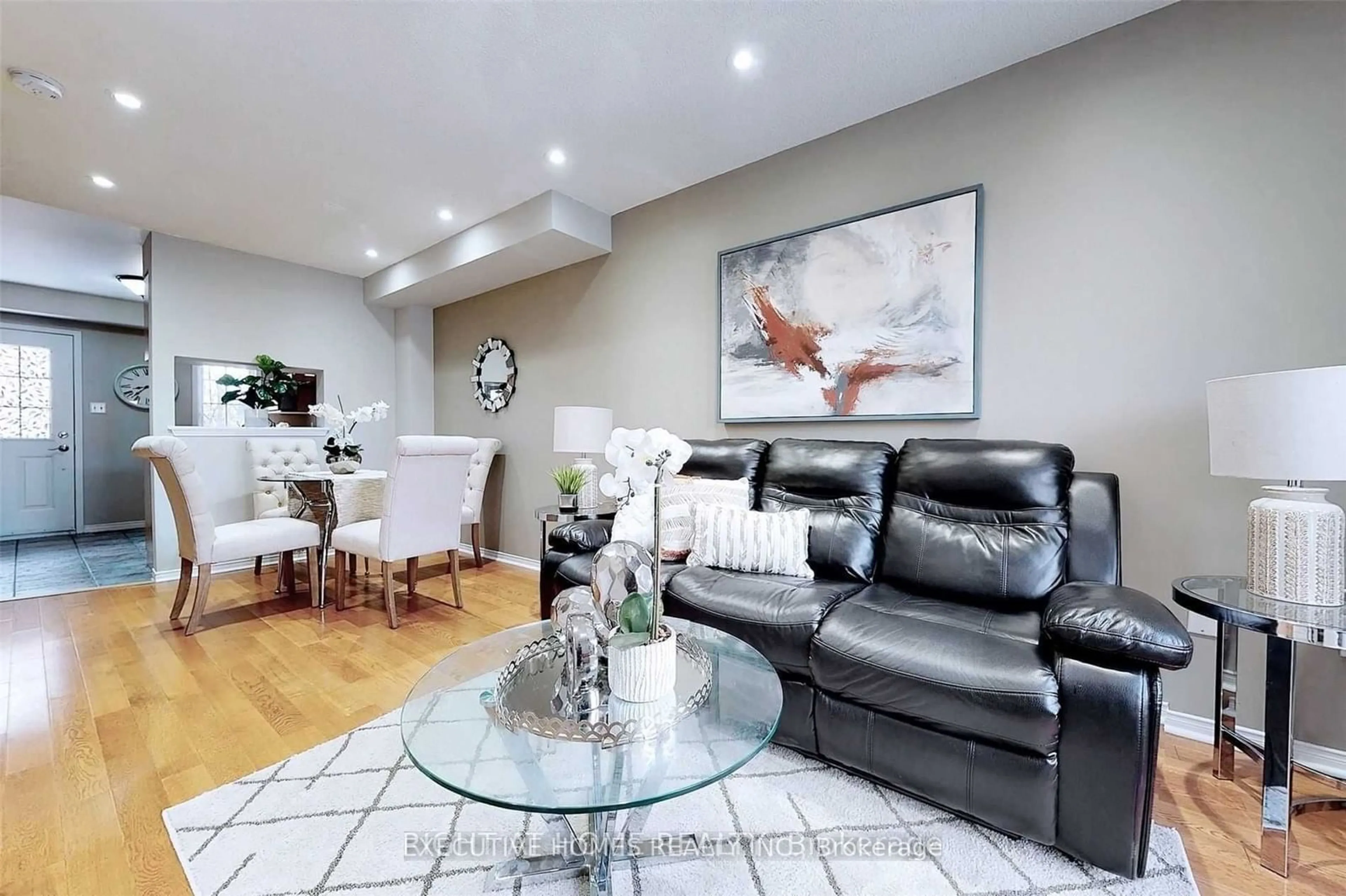 Living room with furniture, wood/laminate floor for 79 Hedge End Rd, Toronto Ontario M1B 5Z4