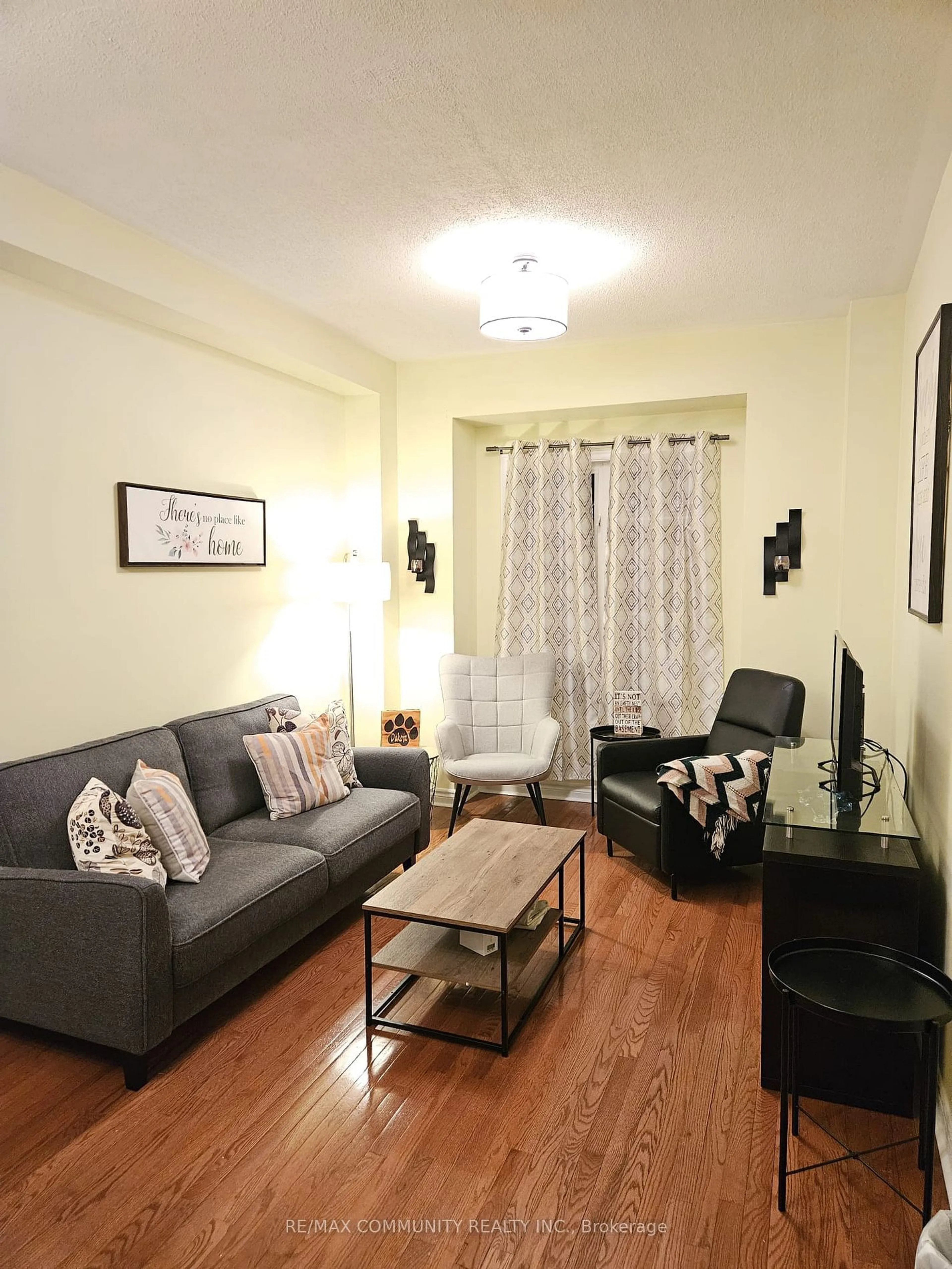 Living room with furniture, wood/laminate floor for 25 Annable Lane #34, Ajax Ontario L1S 7S6