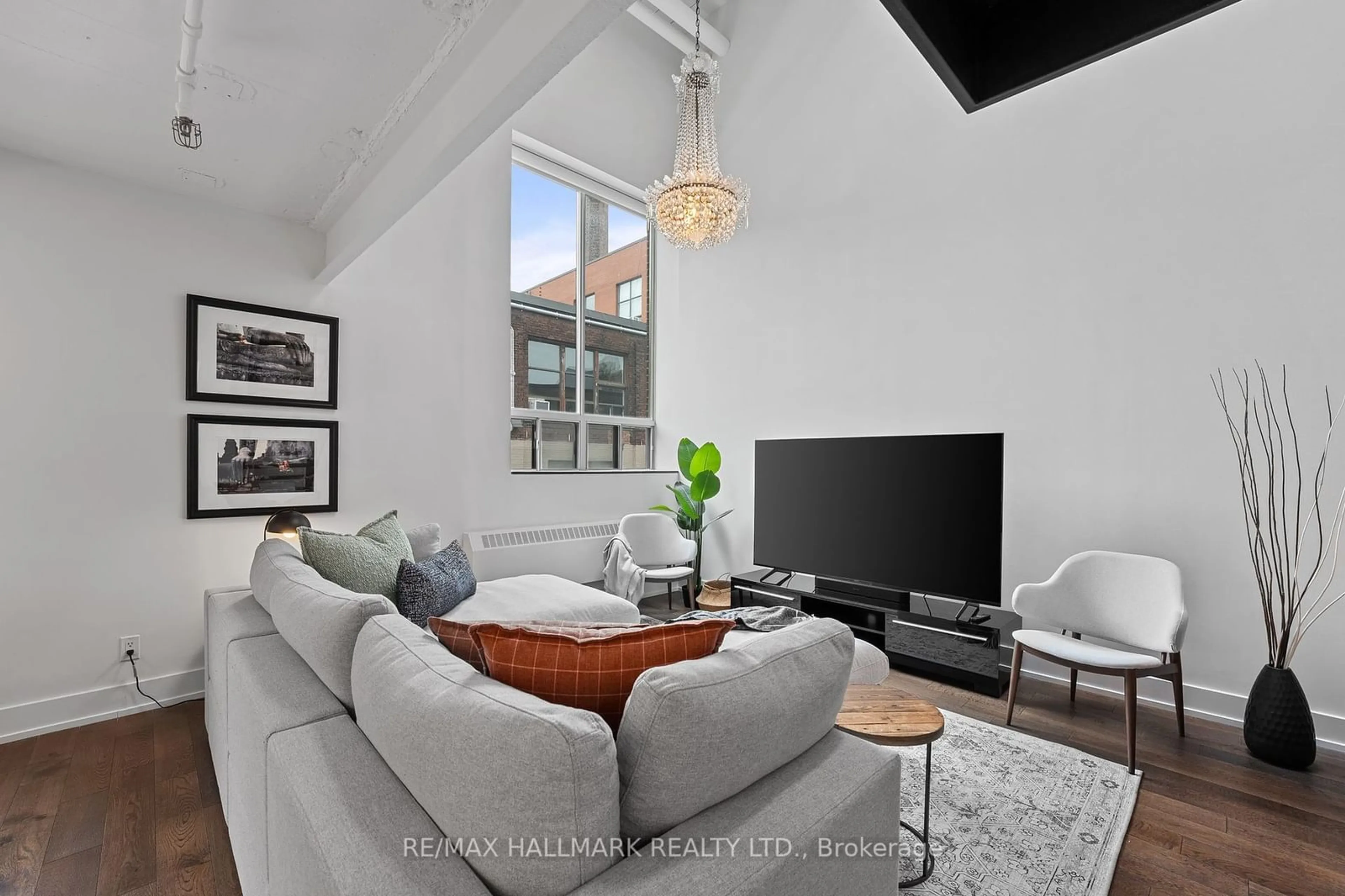 Living room with furniture, unknown for 326 Carlaw Ave #106, Toronto Ontario M4M 3N8