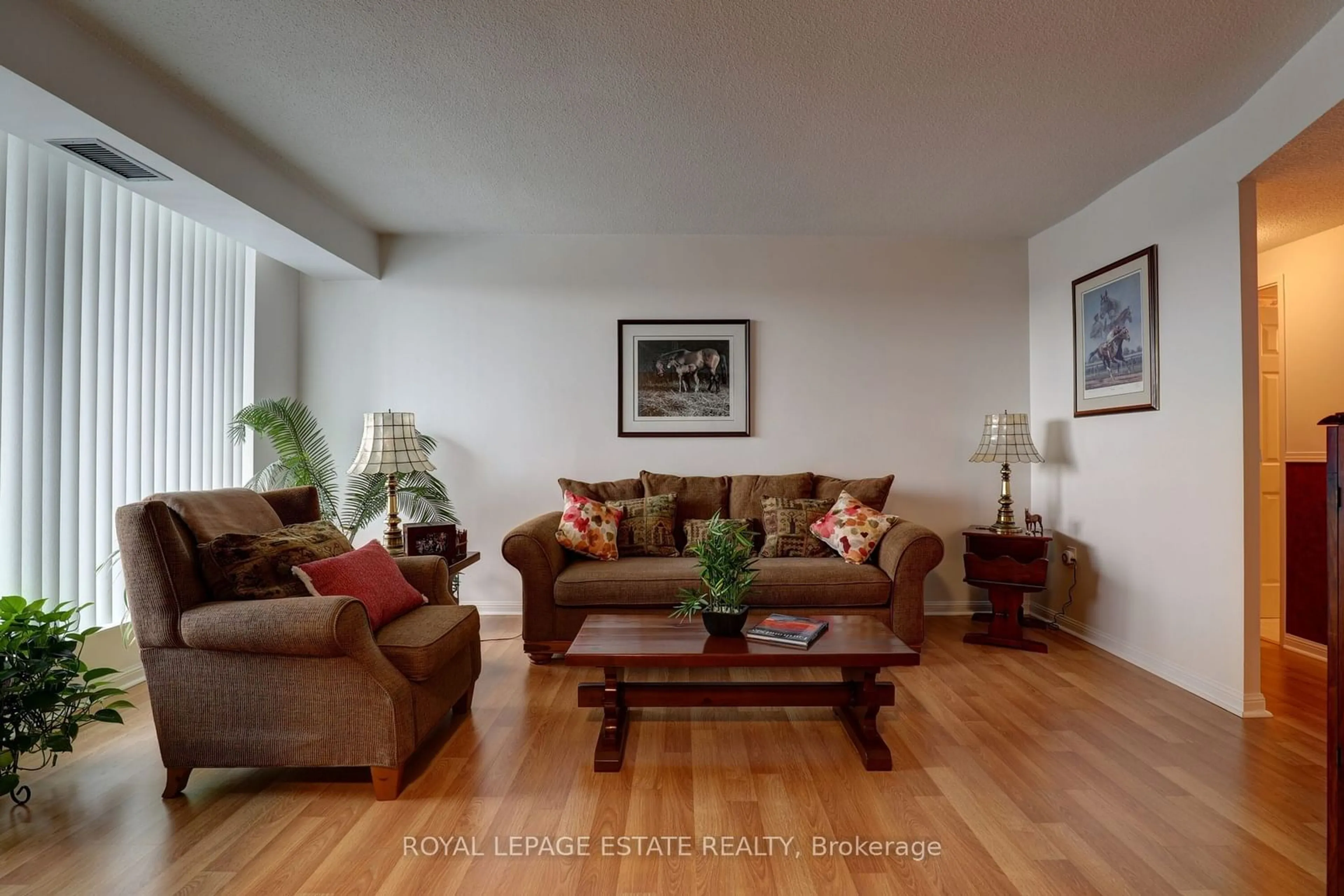 Living room with furniture, wood/laminate floor for 757 Victoria Park Ave #906, Toronto Ontario M4C 5N8