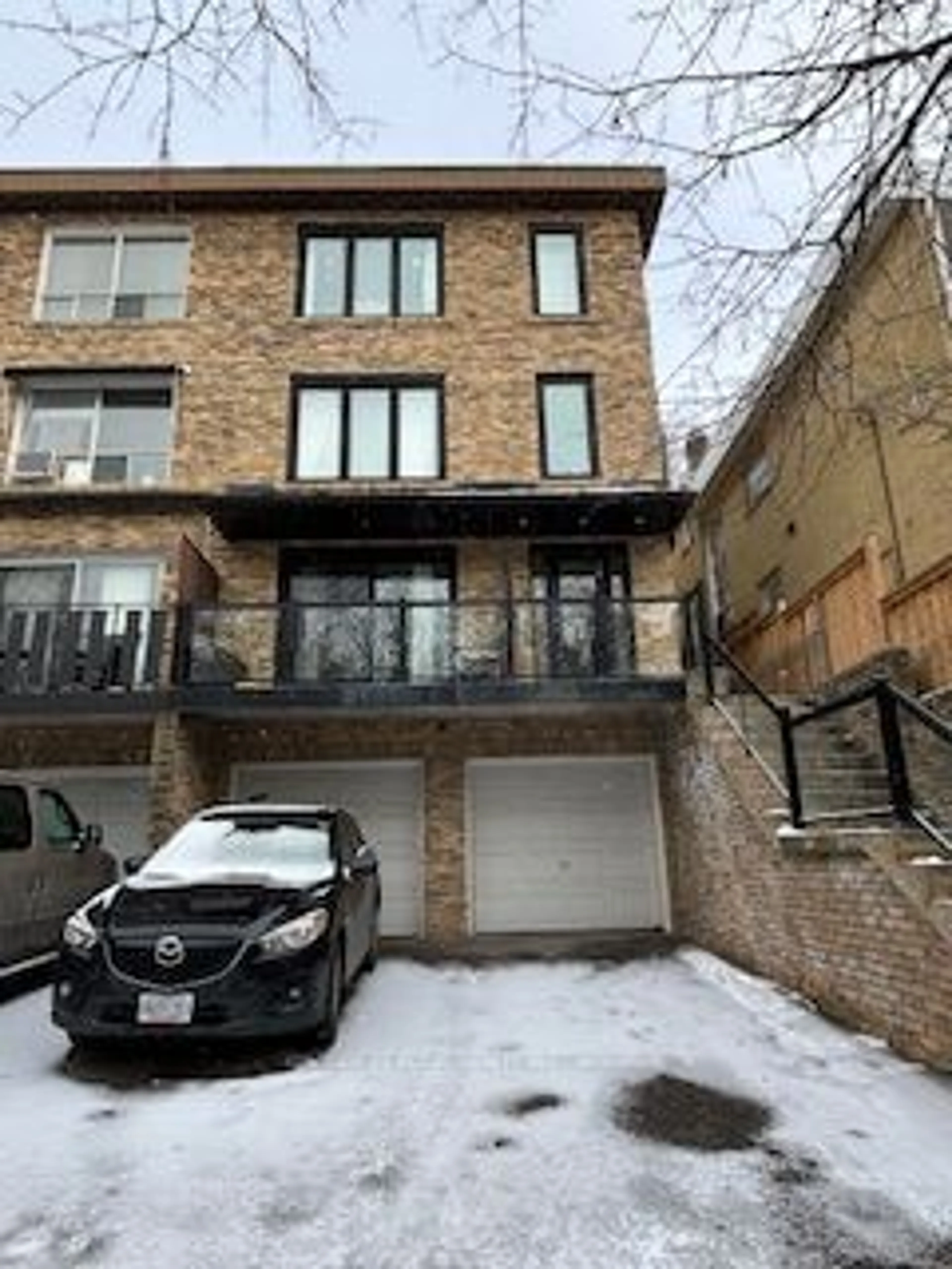 Home with brick exterior material, street for 221 Kenilworth Ave, Toronto Ontario M4L 3S7