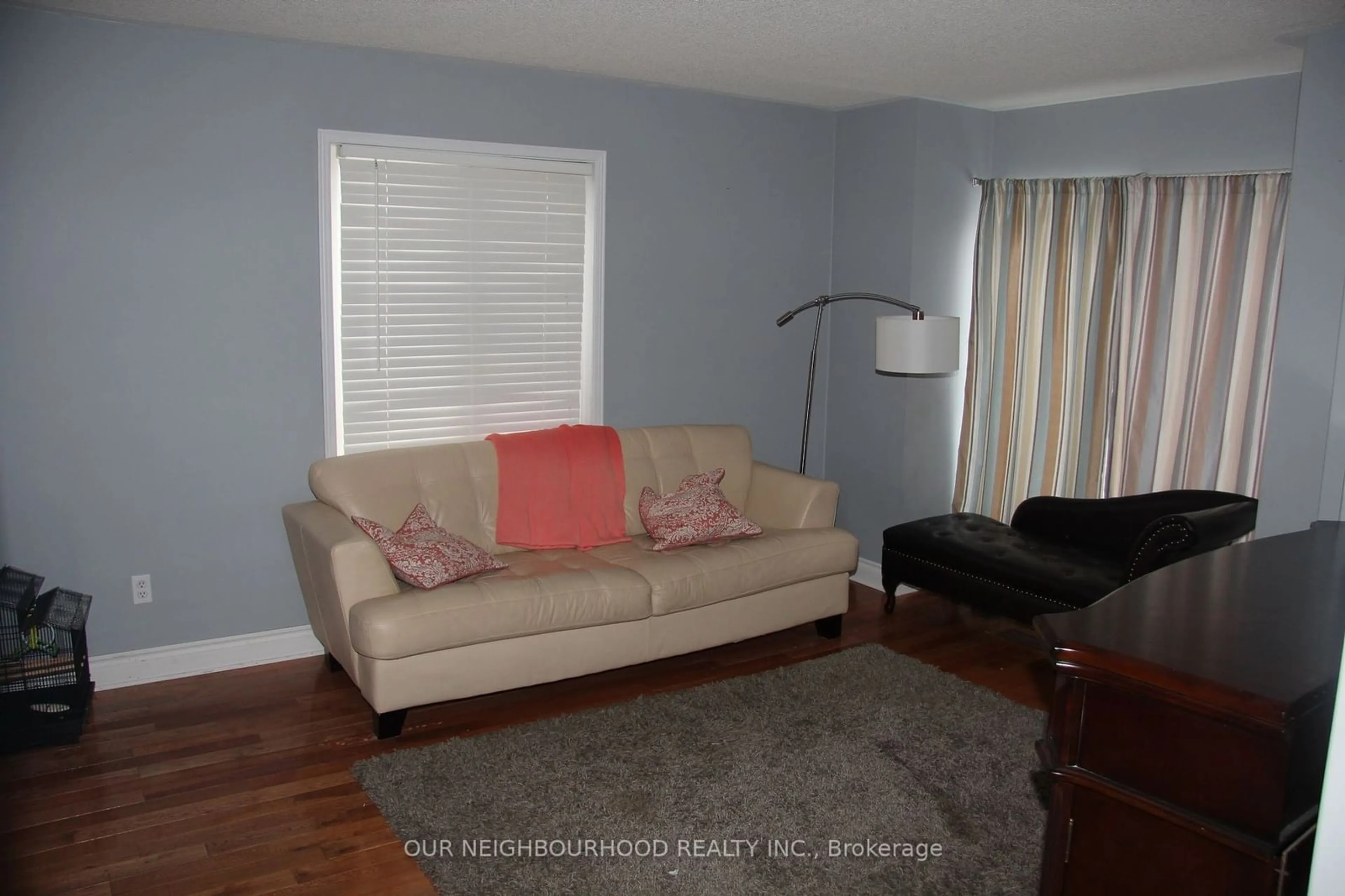 Living room with furniture, wood/laminate floor for 2341 Clearside Crt, Pickering Ontario L1X 2V1