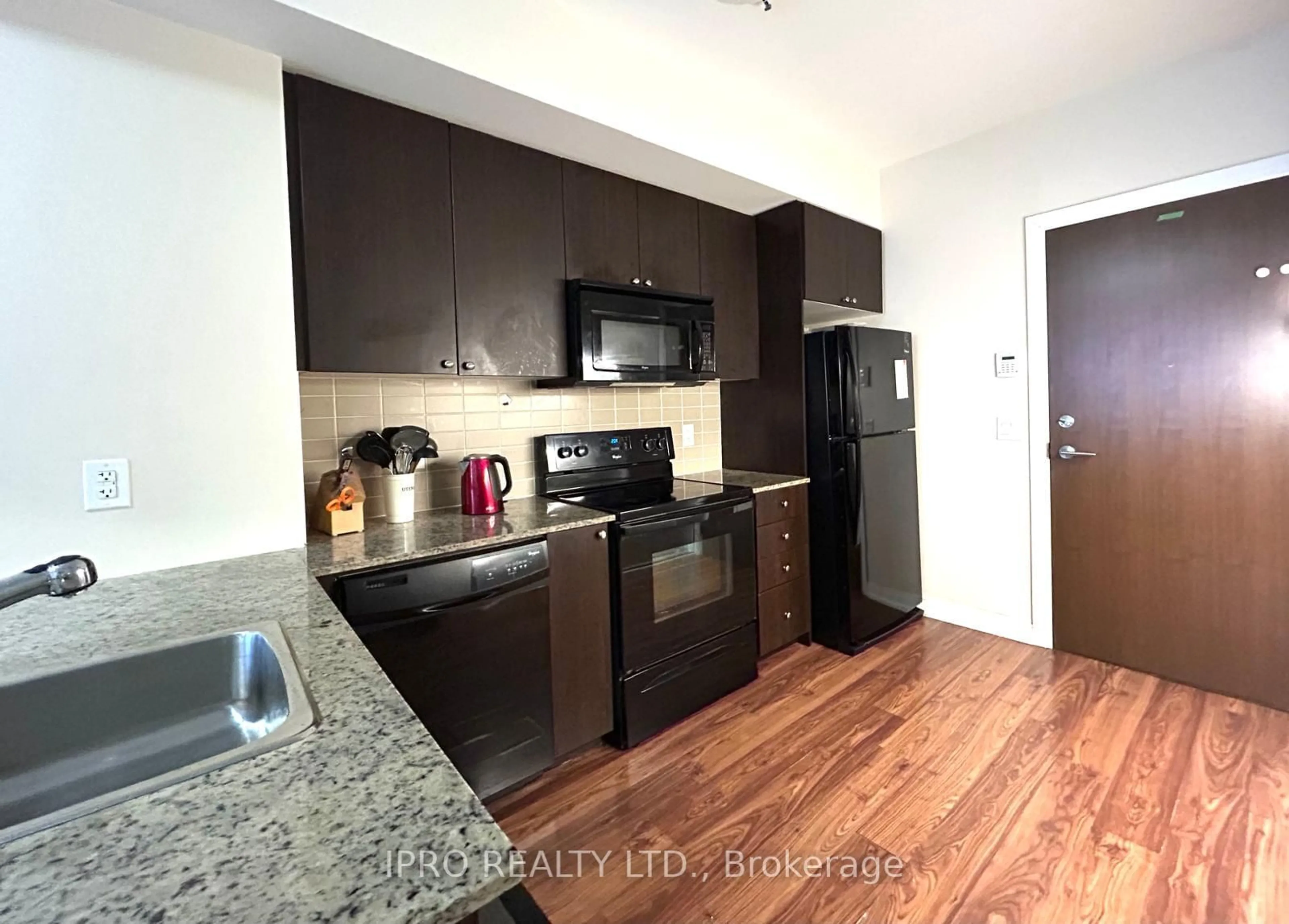 Standard kitchen, wood/laminate floor for 181 VILLAGE GREEN Sq #214, Toronto Ontario M1S 0K6