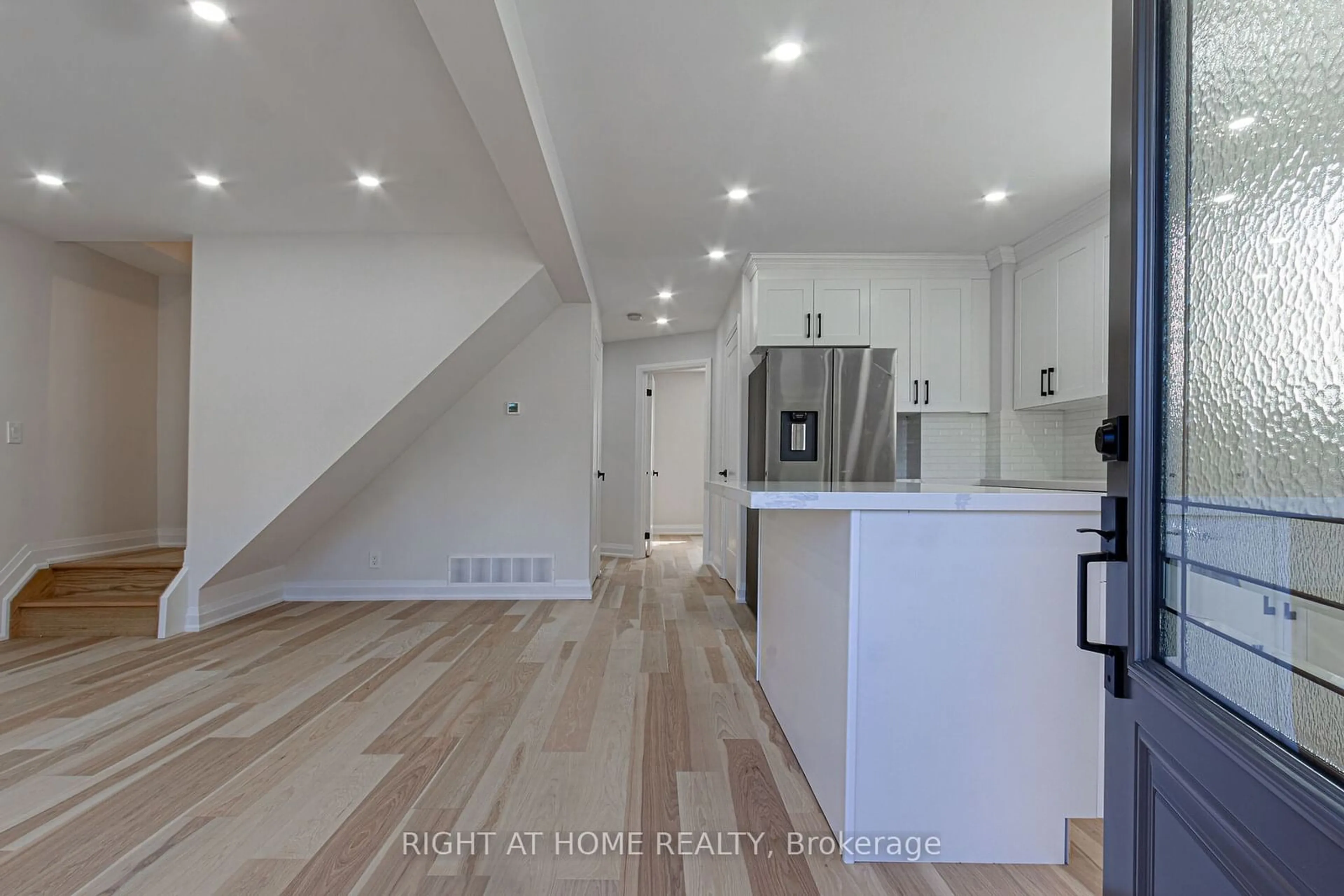 Open concept kitchen, wood/laminate floor for 961 Victoria Park Ave, Toronto Ontario M4B 2J4