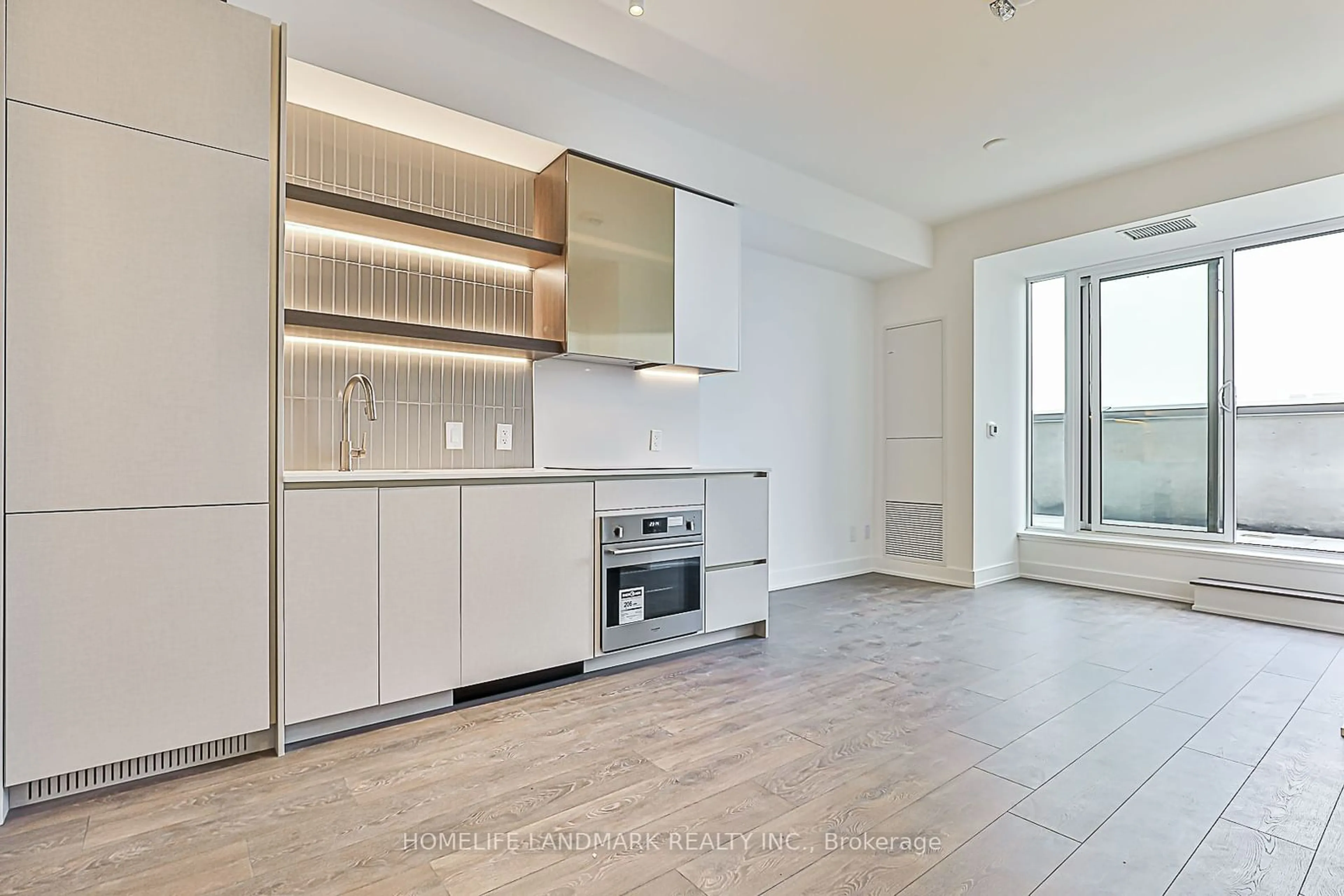 Open concept kitchen, ceramic/tile floor for 1285 Queen St #605, Toronto Ontario M4L 1C2