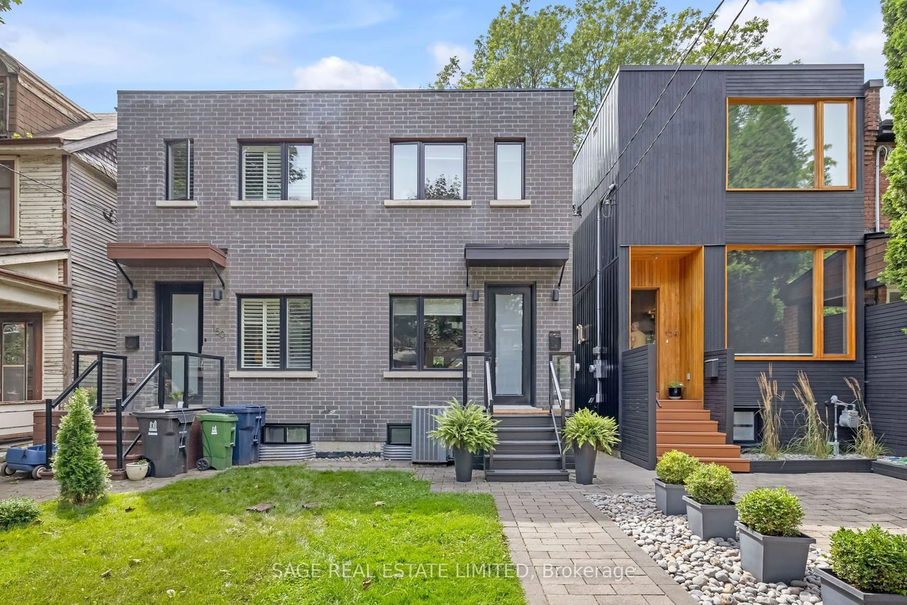 Home with brick exterior material, street for 152 Rhodes Ave, Toronto Ontario M4L 3A1