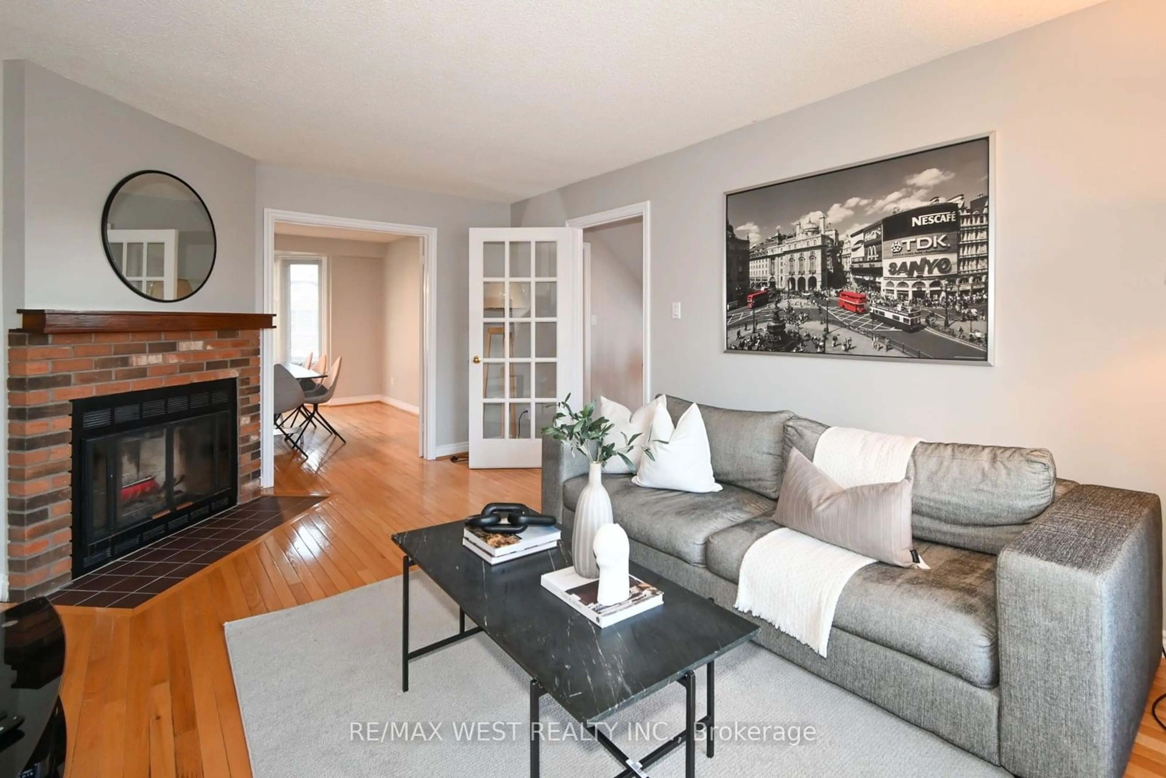 Living room with furniture, wood/laminate floor for 45 Birchmount Rd #10, Toronto Ontario M1N 3J5