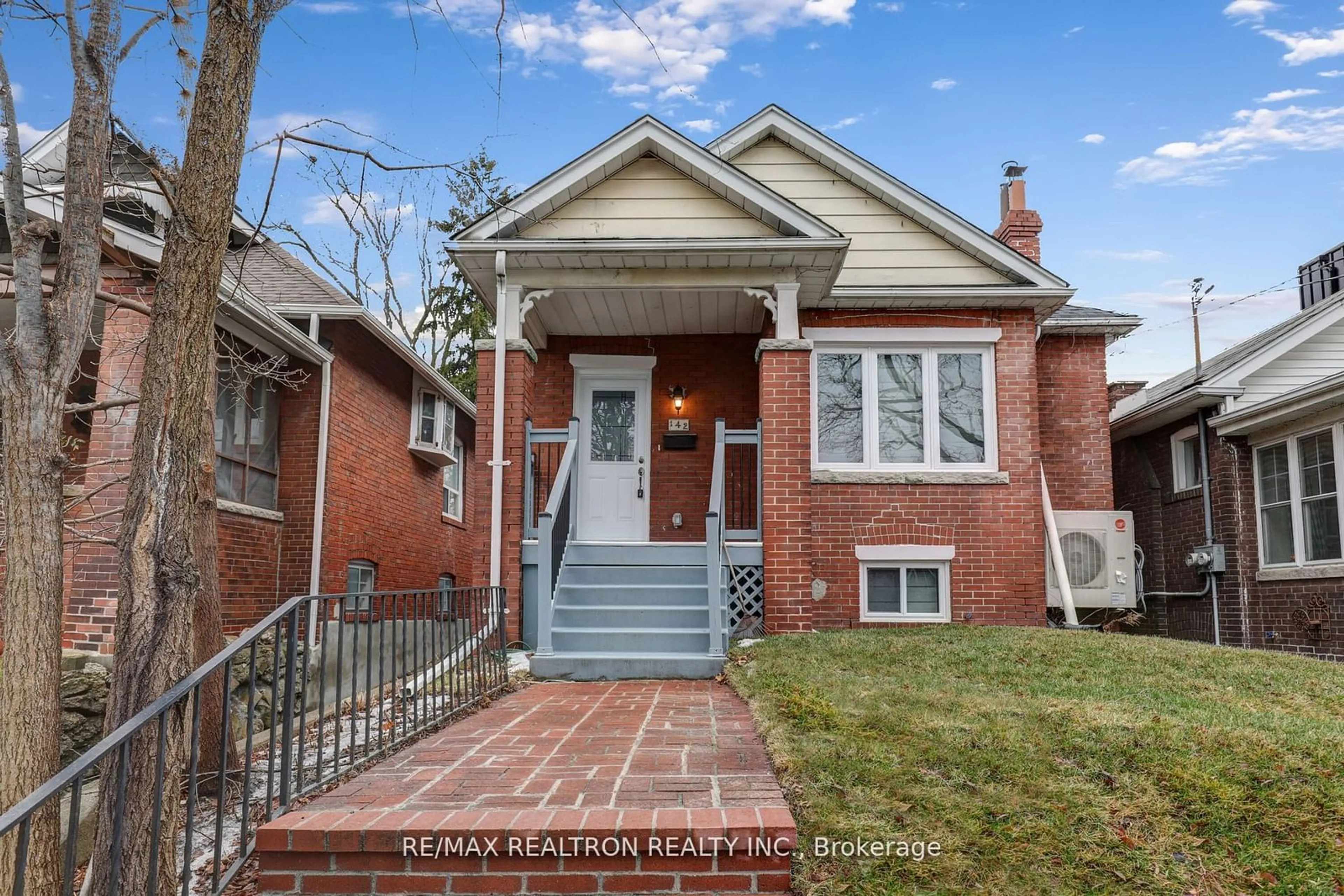 Home with brick exterior material, street for 142 Eastwood Rd, Toronto Ontario M4L 2C9