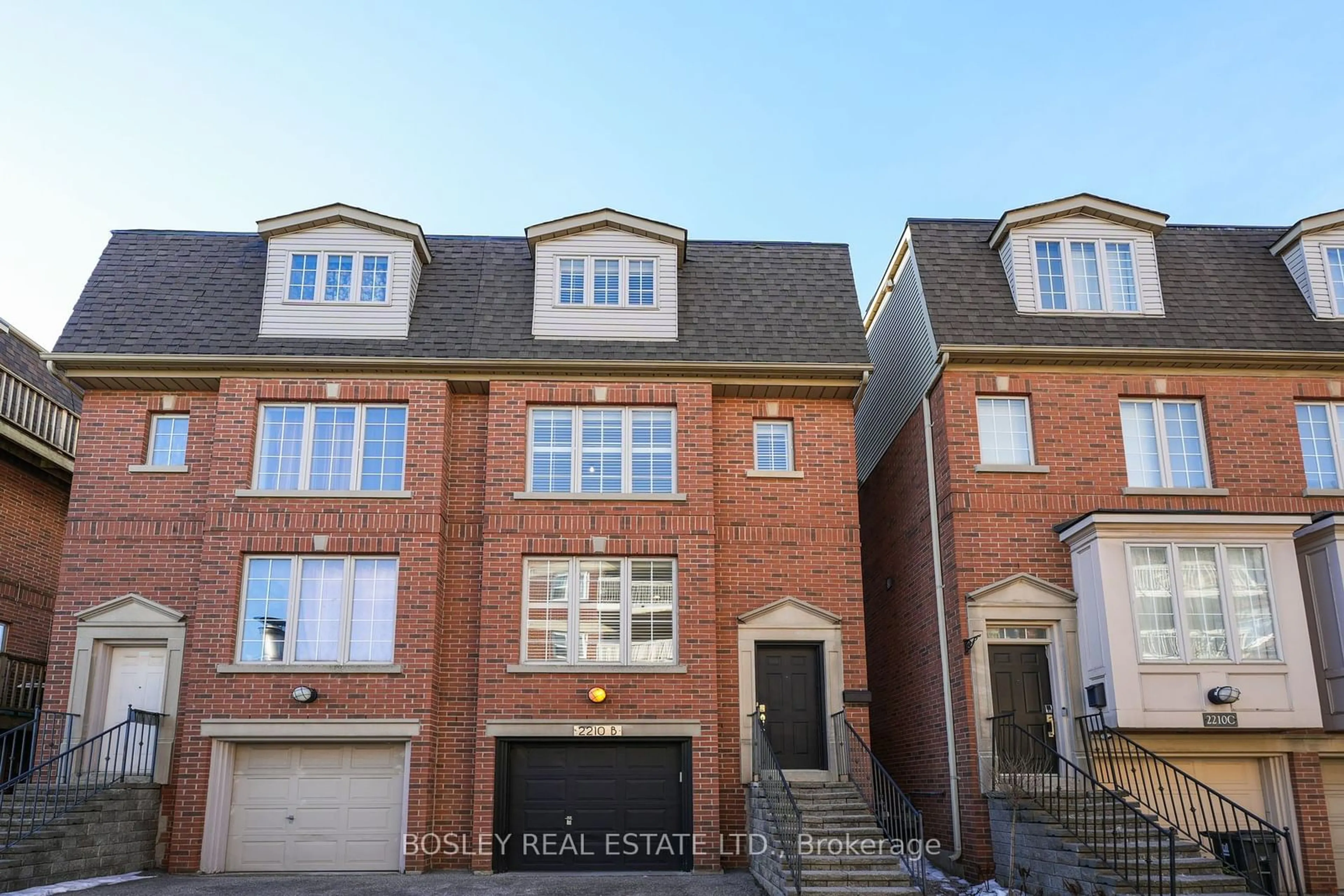 Home with brick exterior material, street for 2210B Gerrard St, Toronto Ontario M4E 2C7