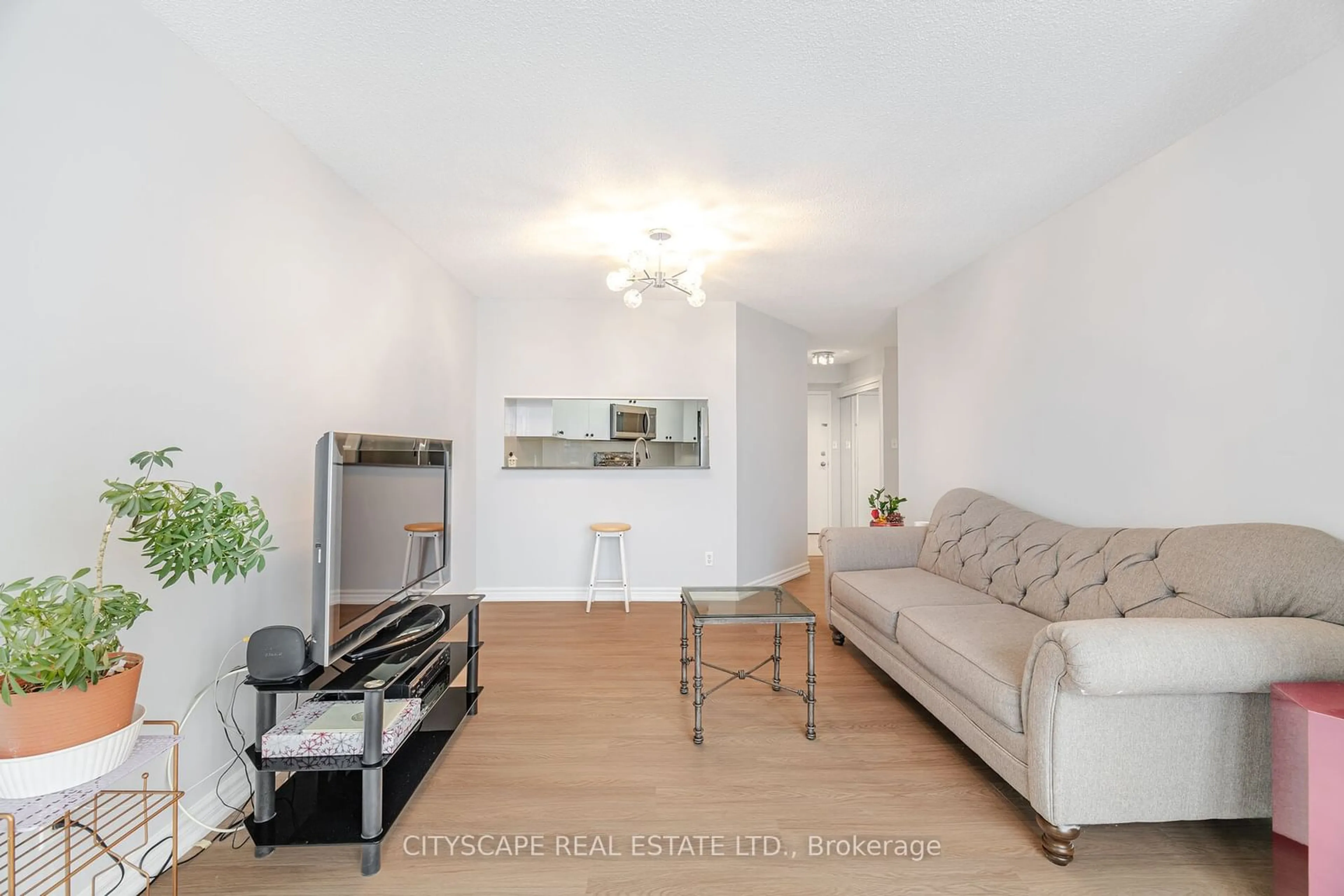 Living room with furniture, wood/laminate floor for 2550 Lawrence Ave #1411, Toronto Ontario M1P 4Z3