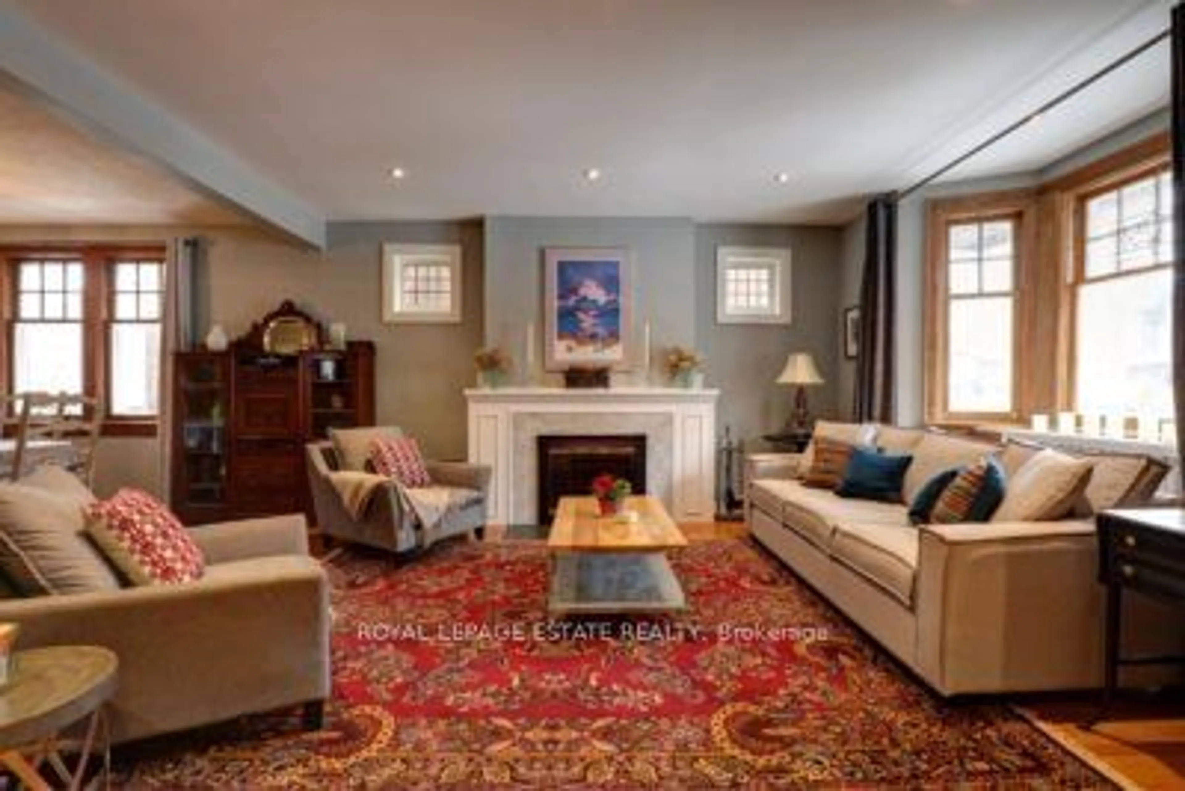 Living room with furniture, carpet floor for 202 Bingham Ave, Toronto Ontario M4E 3R5