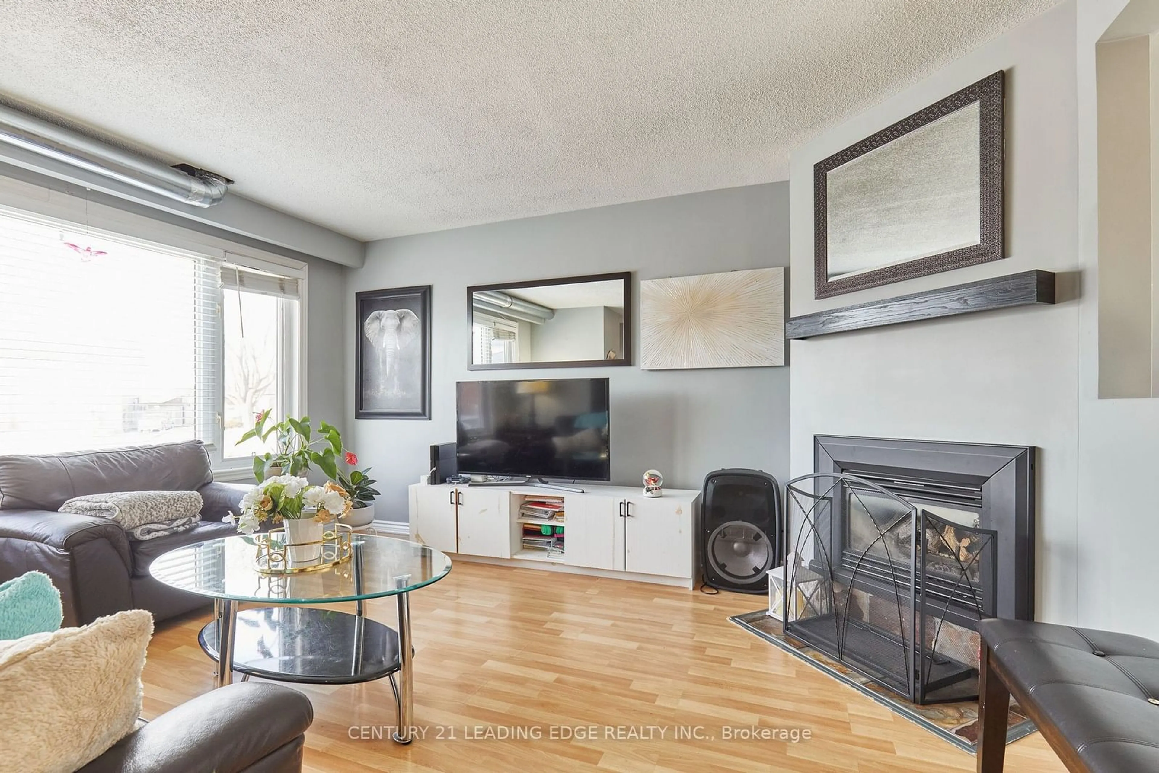 Living room with furniture, wood/laminate floor for 1313 Lakefield Crt, Oshawa Ontario L1J 3Y5