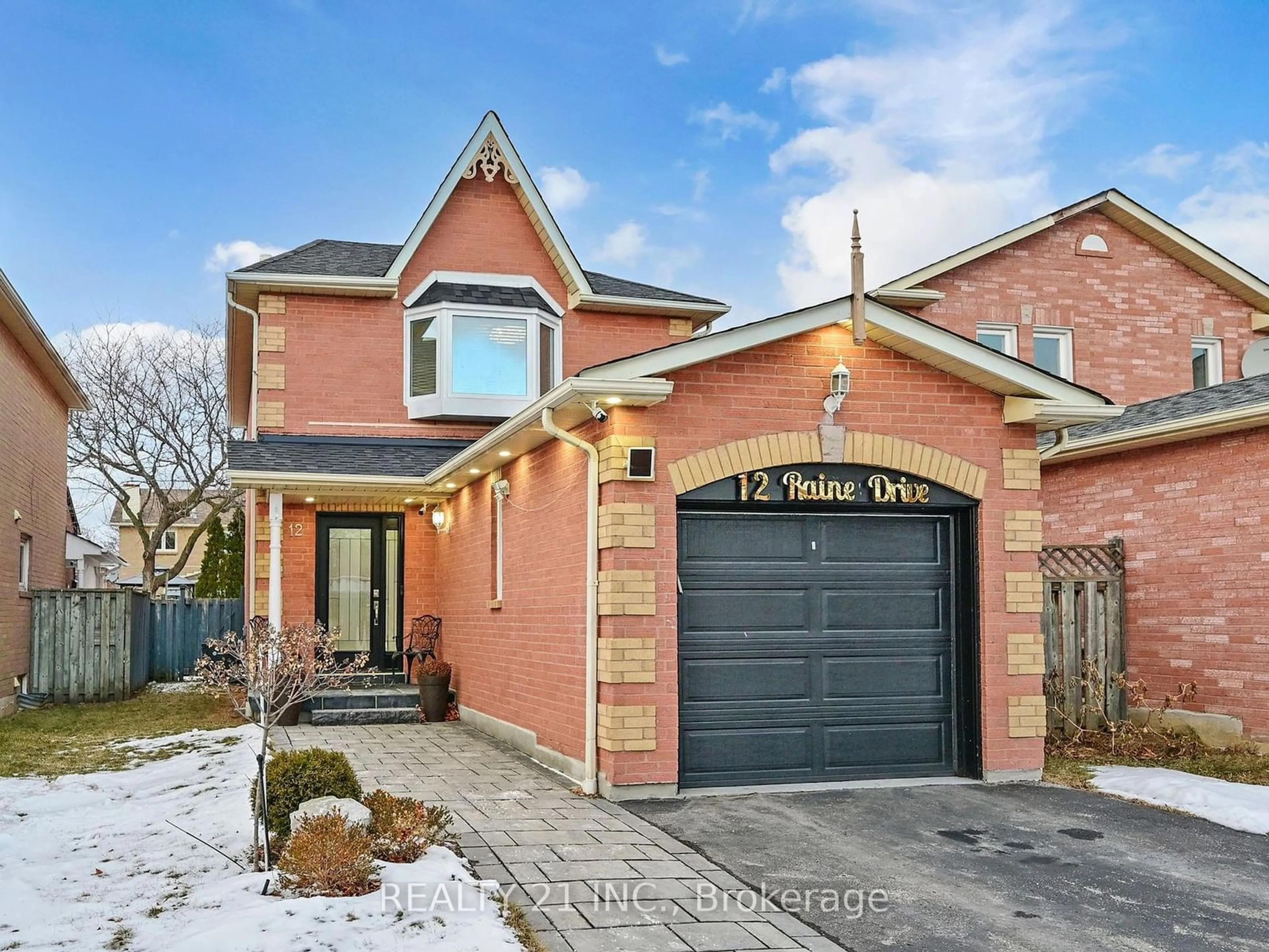 Home with brick exterior material, street for 12 Raine Dr, Ajax Ontario L1T 3L6