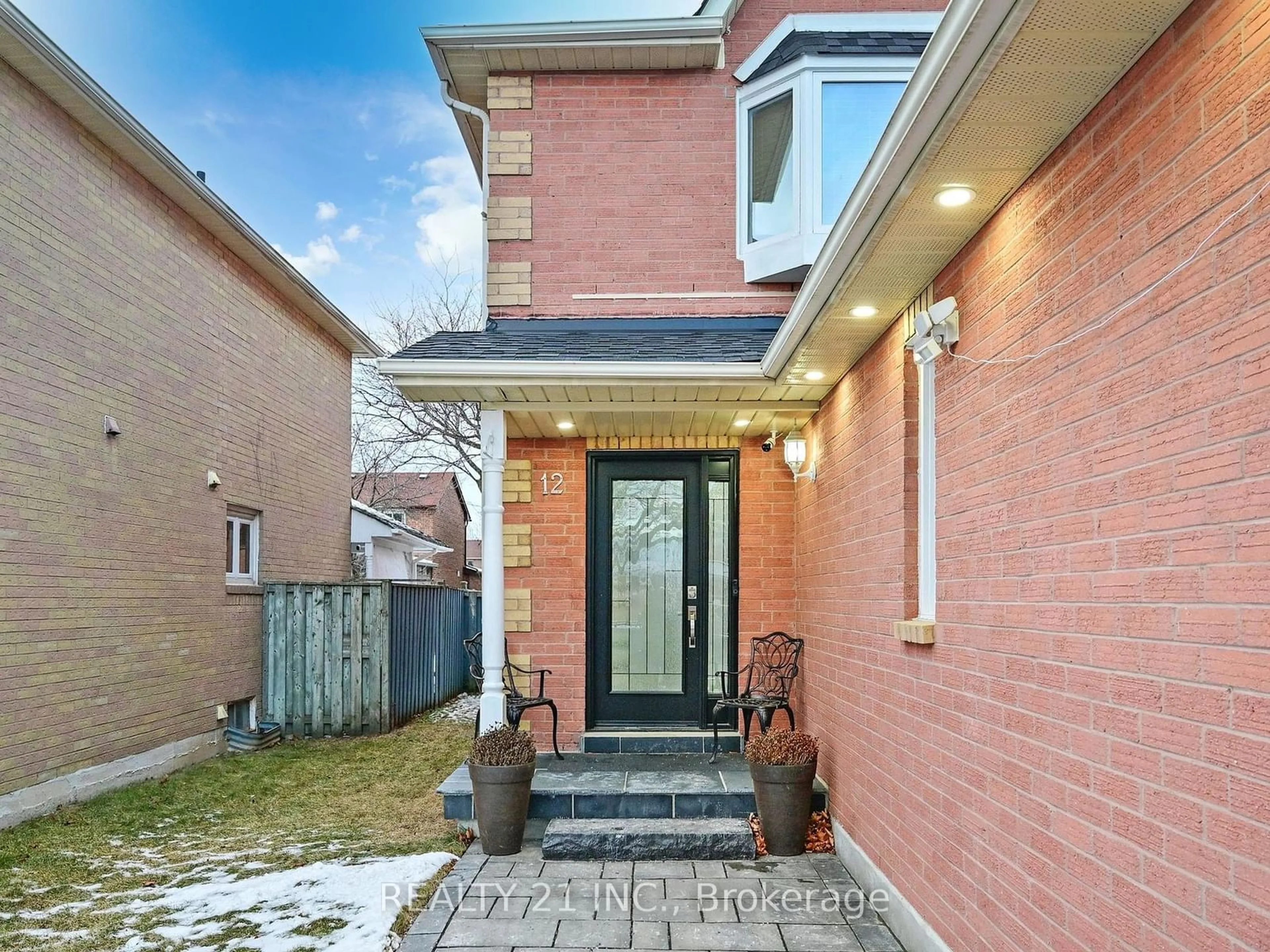 Home with brick exterior material, street for 12 Raine Dr, Ajax Ontario L1T 3L6