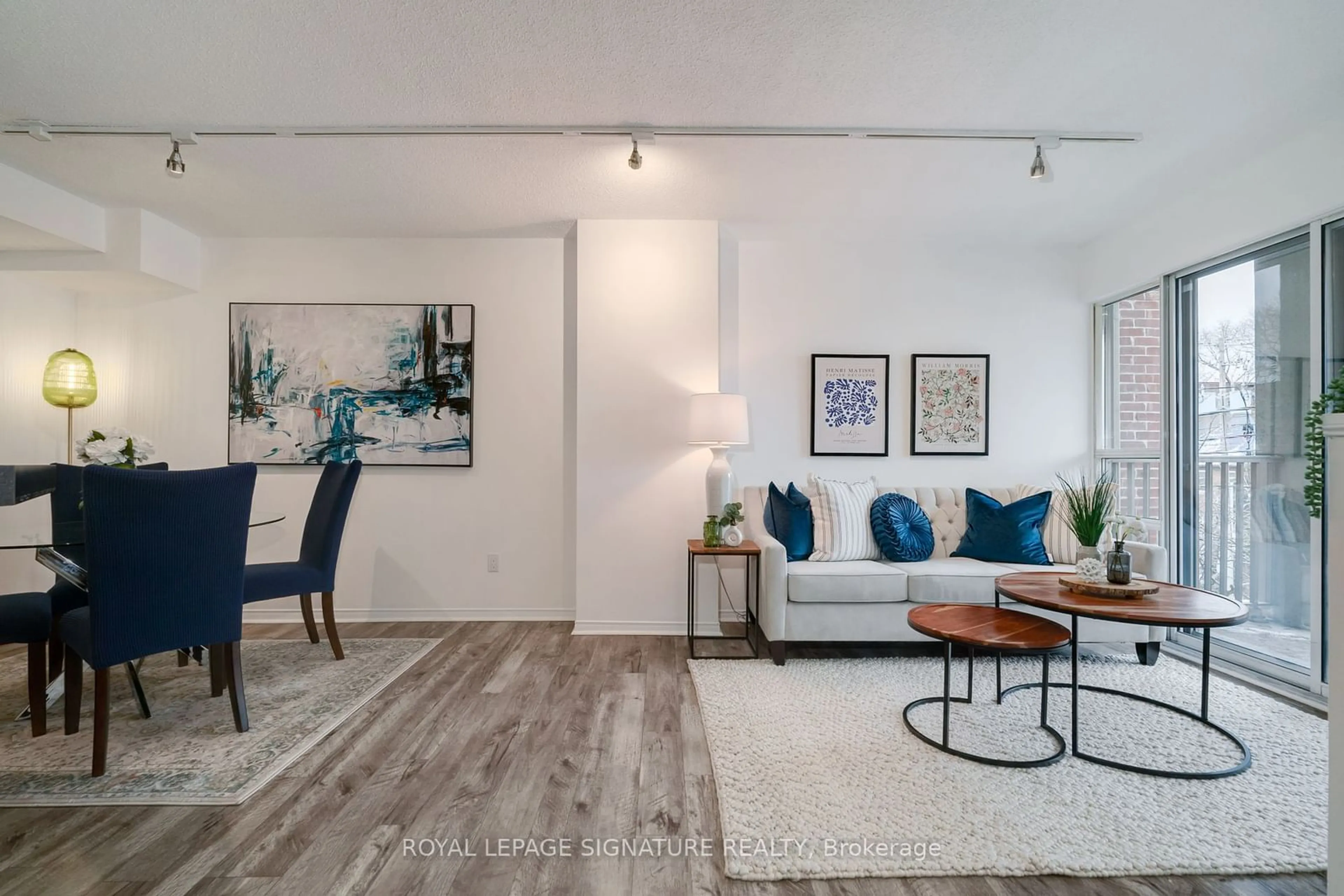 Living room with furniture, wood/laminate floor for 716 Kingston Rd #301, Toronto Ontario M4E 1R7