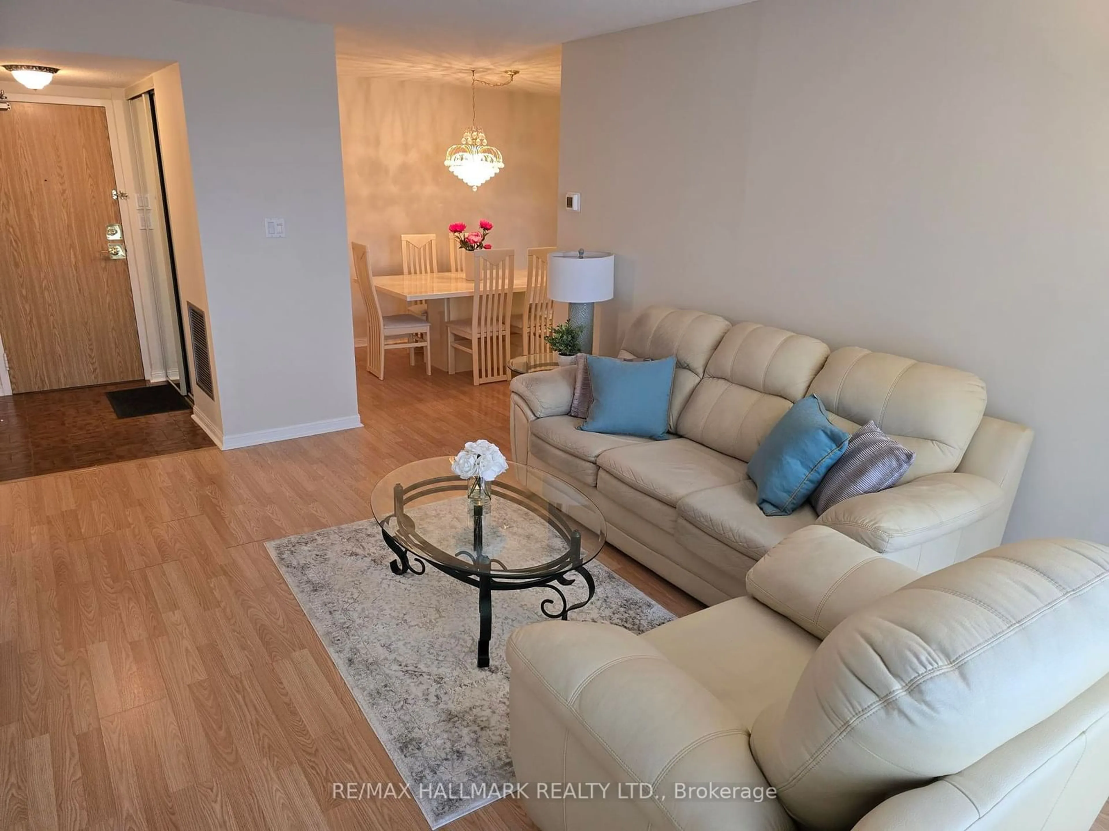 Living room with furniture, wood/laminate floor for 757 Victoria Park Ave #607, Toronto Ontario M4C 5N8