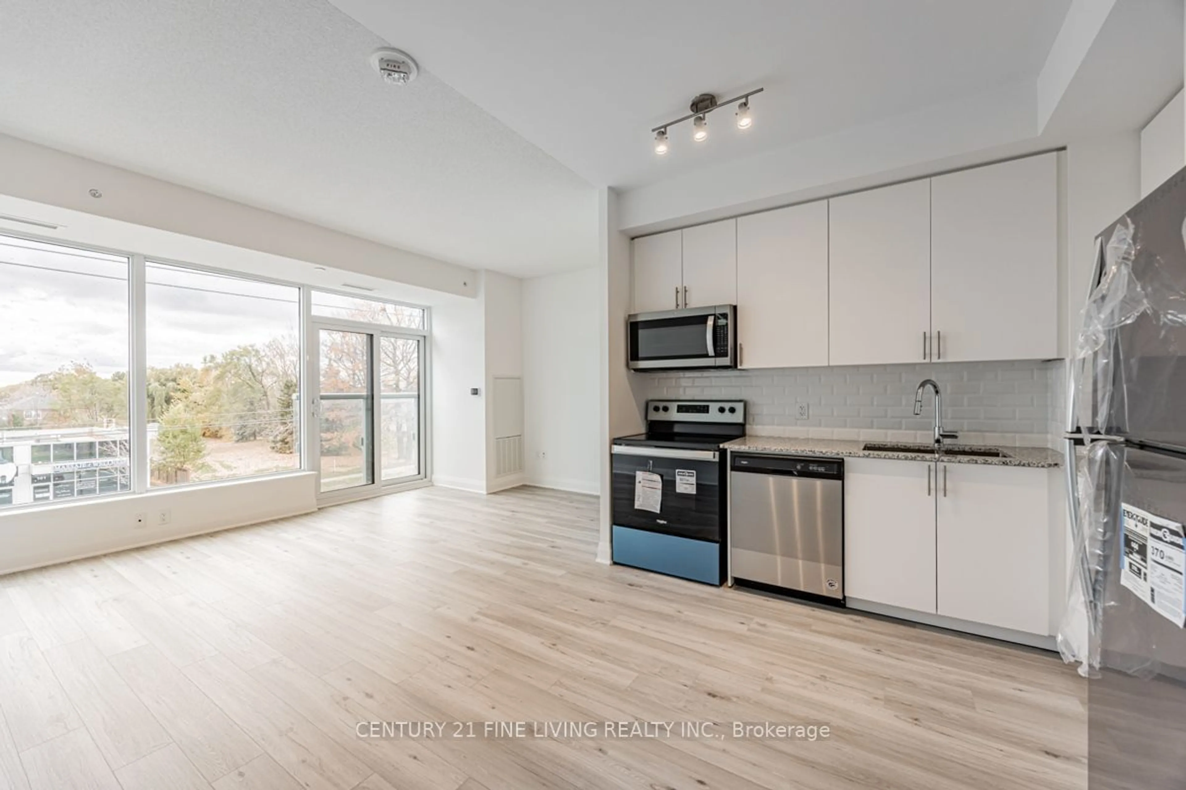 Open concept kitchen, unknown for 3220 Sheppard Ave #318, Toronto Ontario M1T 0B7