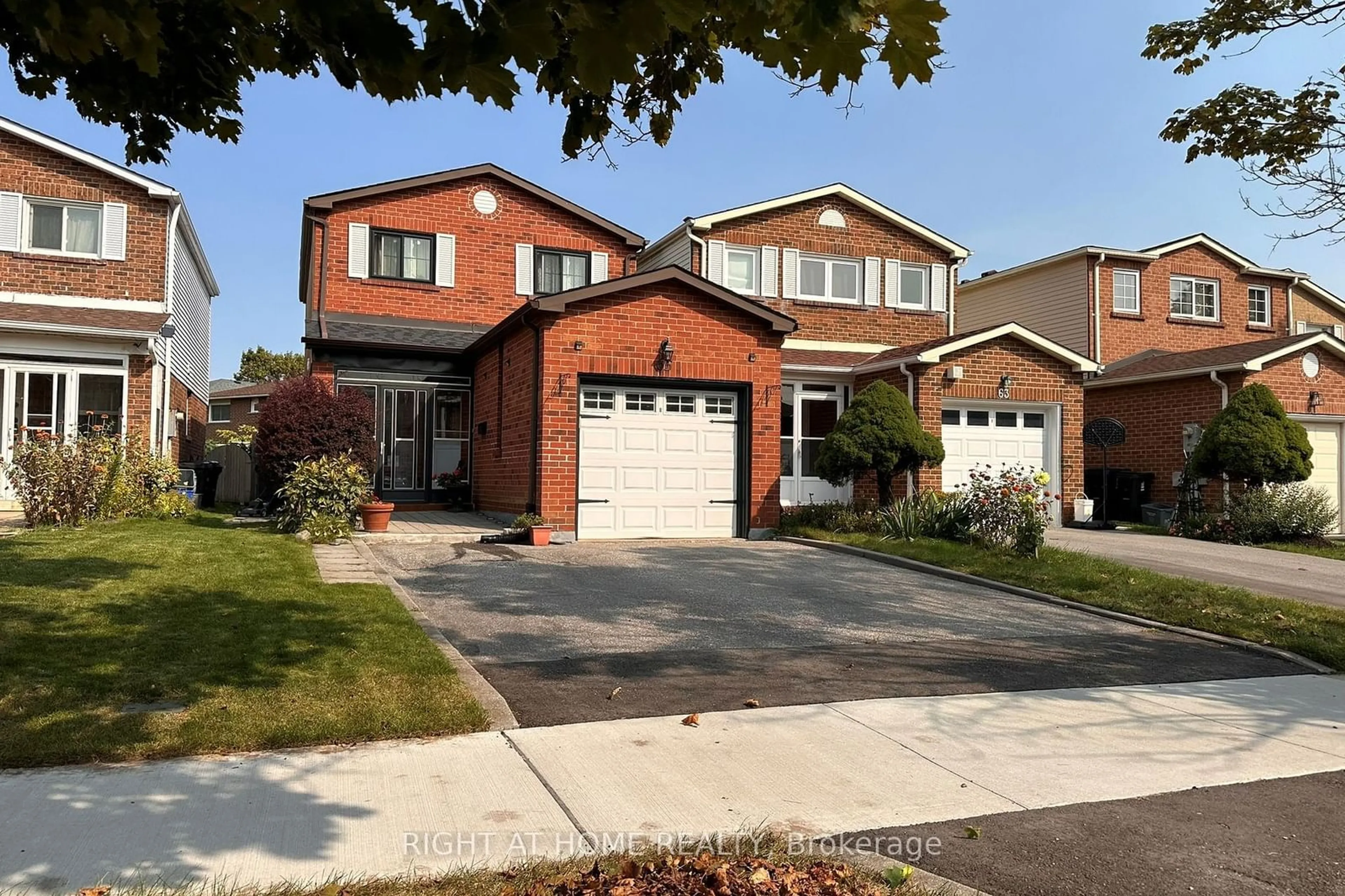 Home with brick exterior material, street for 65 Longsword Dr, Toronto Ontario M1V 3A1