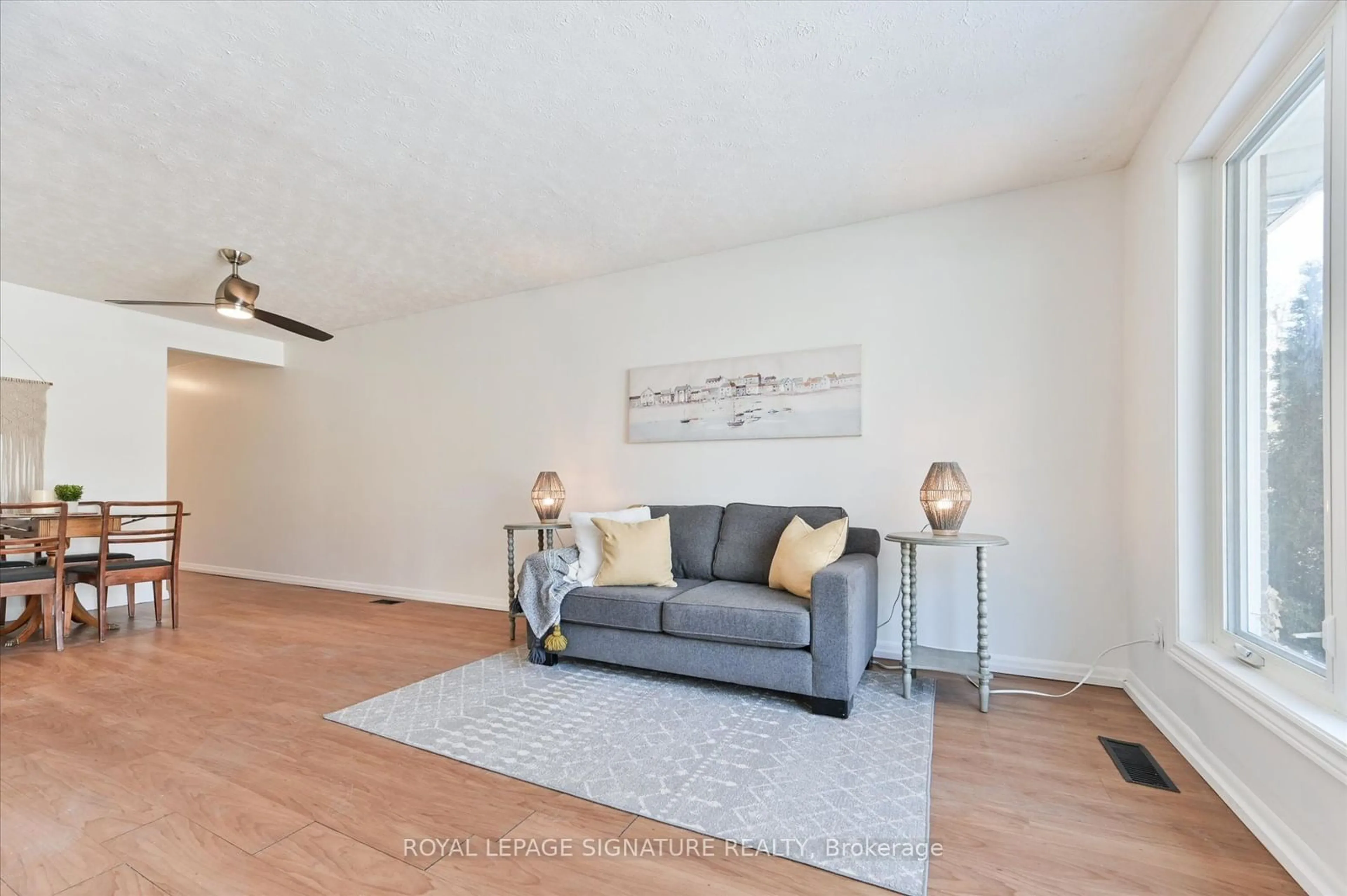 Living room with furniture, wood/laminate floor for 78 Birkdale Rd, Toronto Ontario M1P 3R5