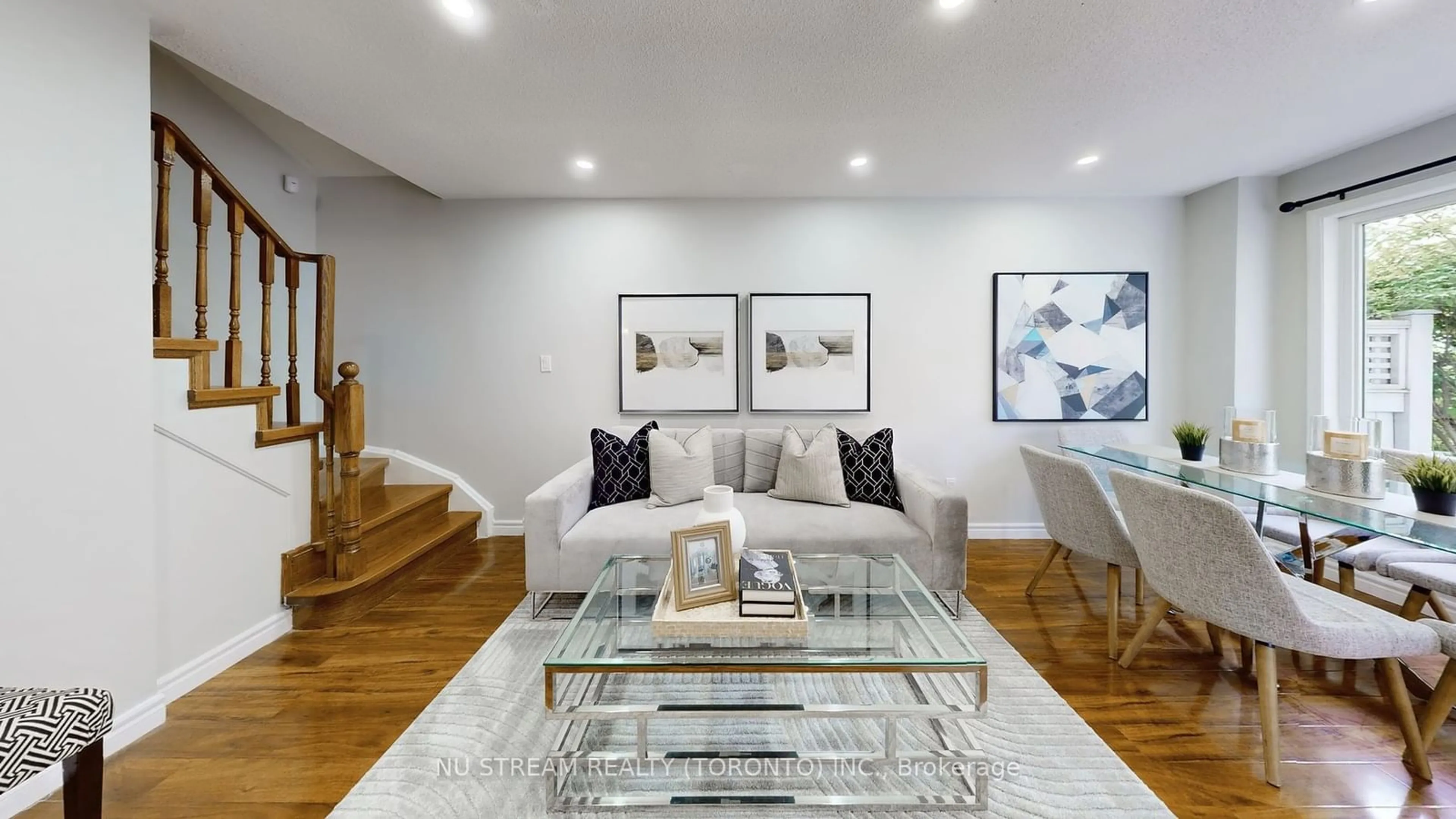 Living room with furniture, wood/laminate floor for 29 Rosebank Dr #1108, Toronto Ontario M1B 5Y7