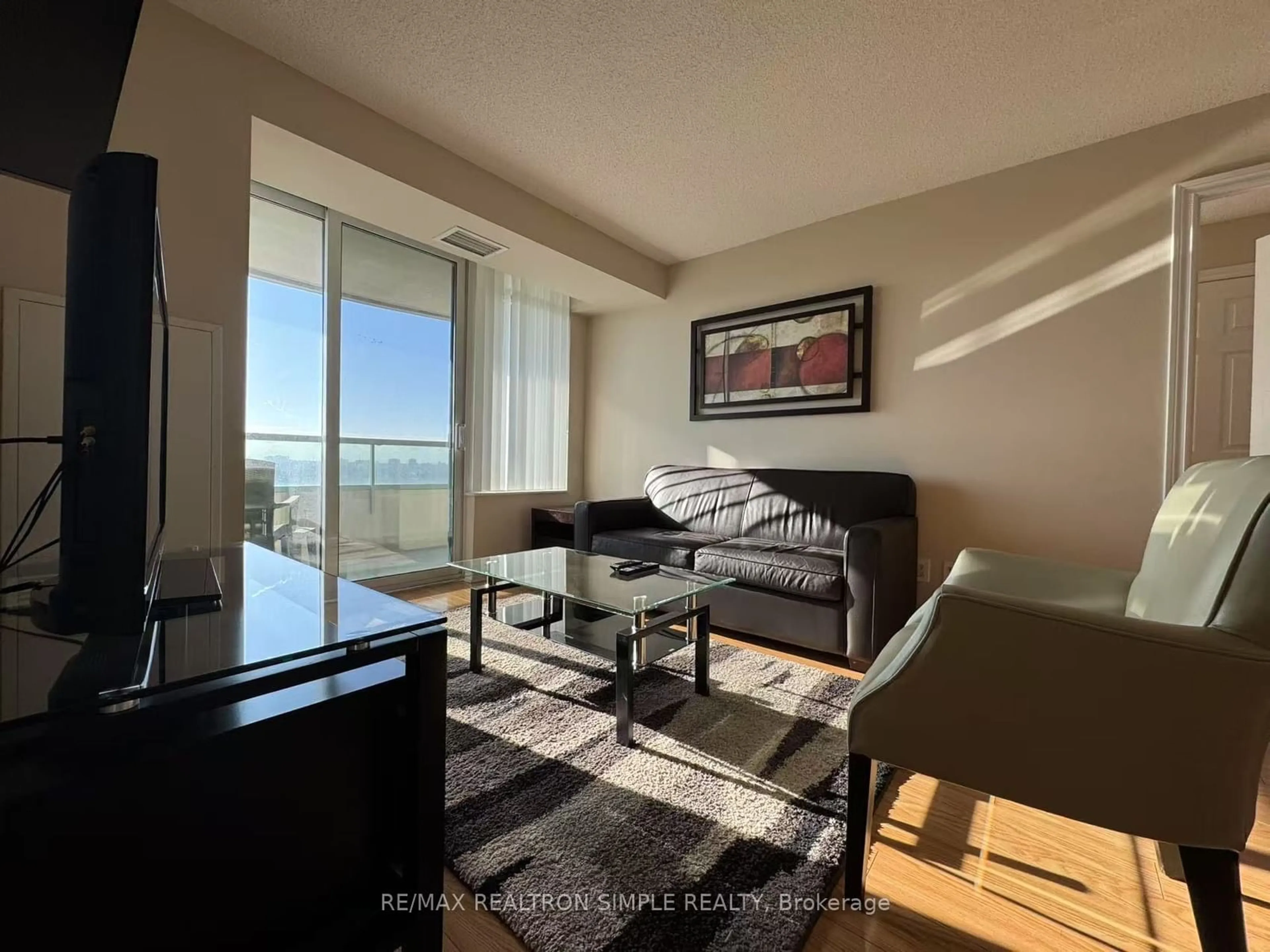 Living room with furniture, wood/laminate floor for 61 Town Centre Crt #1312, Toronto Ontario M1P 5C5