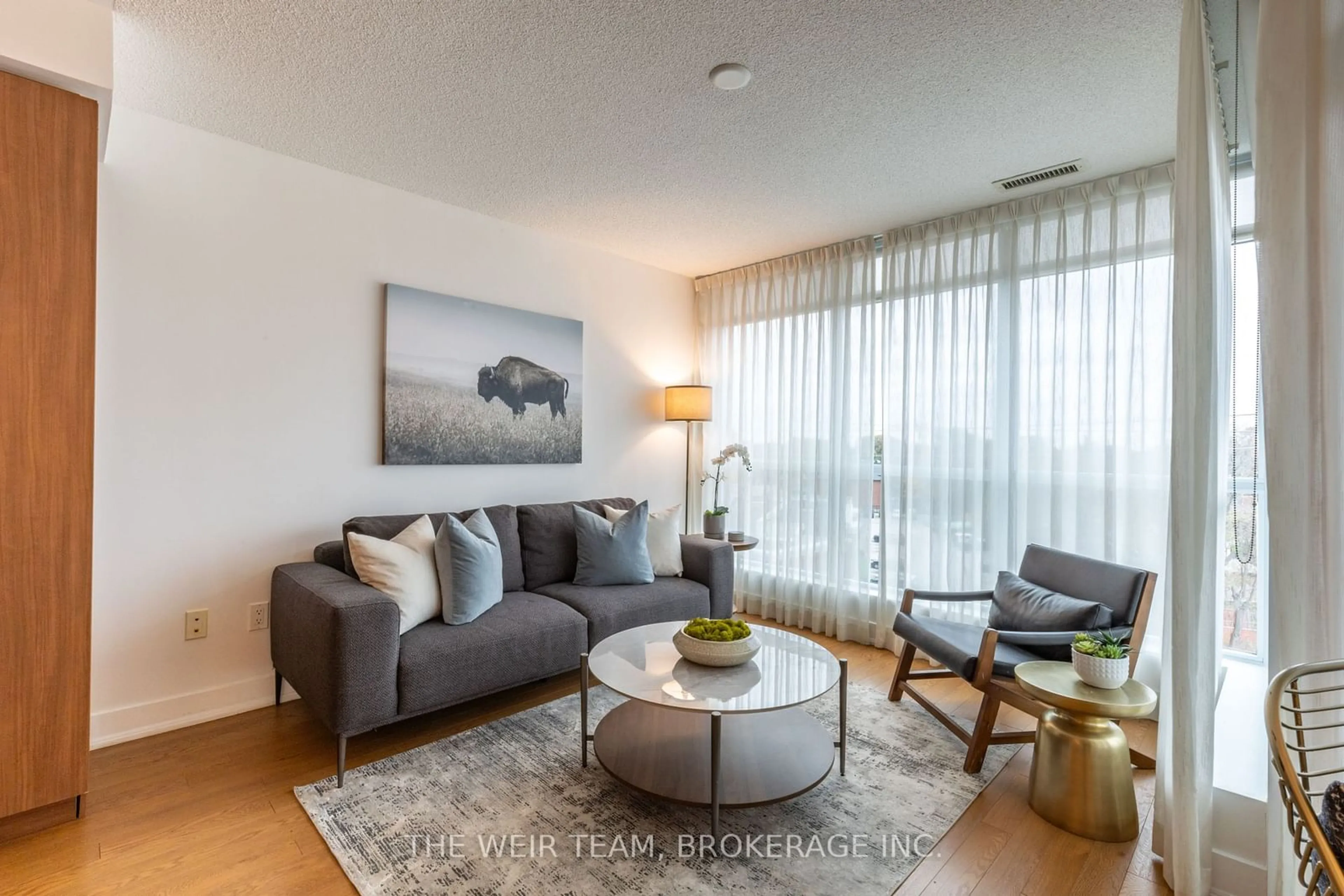 Living room with furniture, wood/laminate floor for 1048 Broadview Ave #505, Toronto Ontario M4K 2B8