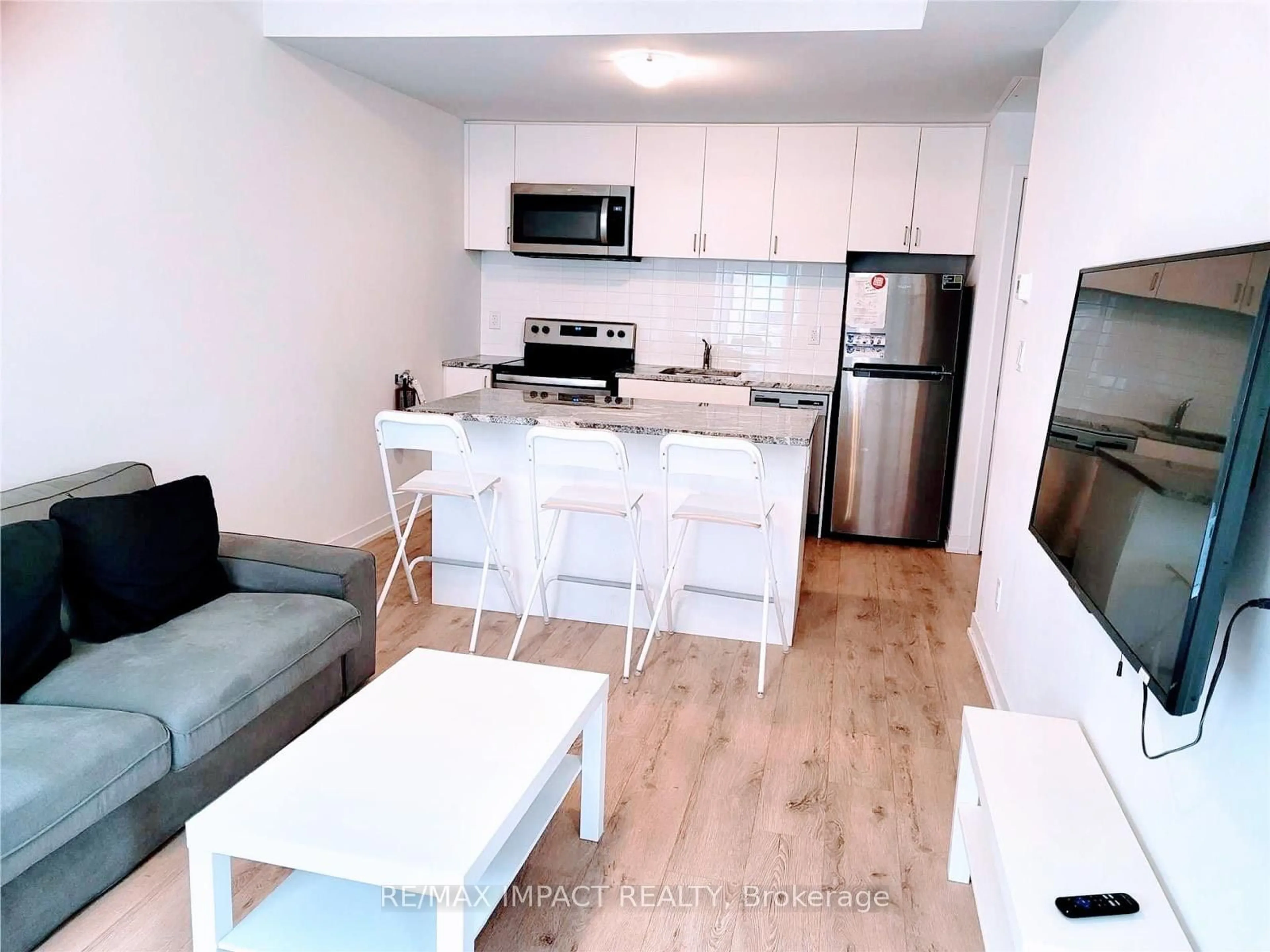 Open concept kitchen, wood/laminate floor for 1740 Simcoe St #49, Oshawa Ontario L1G 0C3