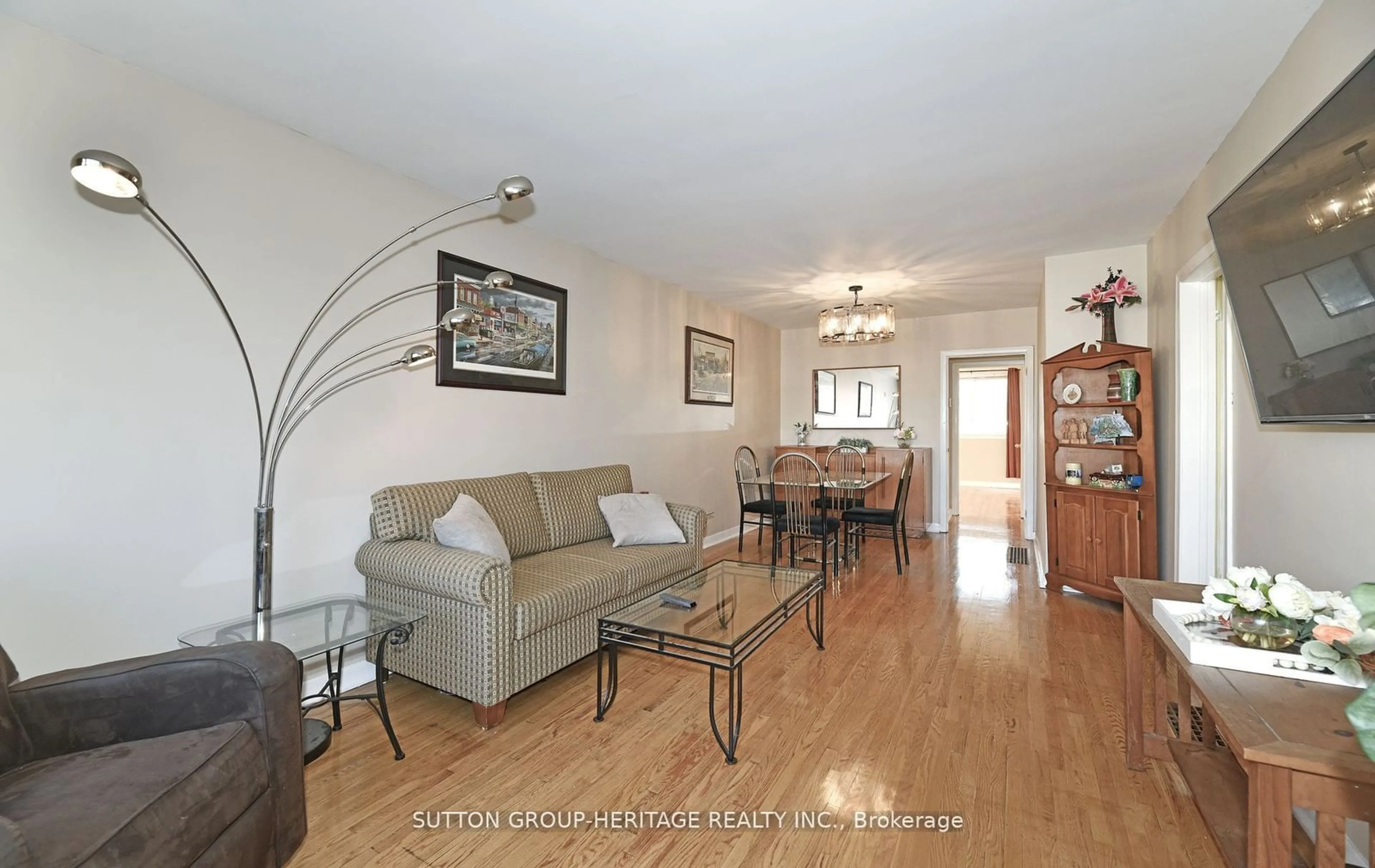 Living room with furniture, wood/laminate floor for 86 Burcher Rd, Ajax Ontario L1S 2R2