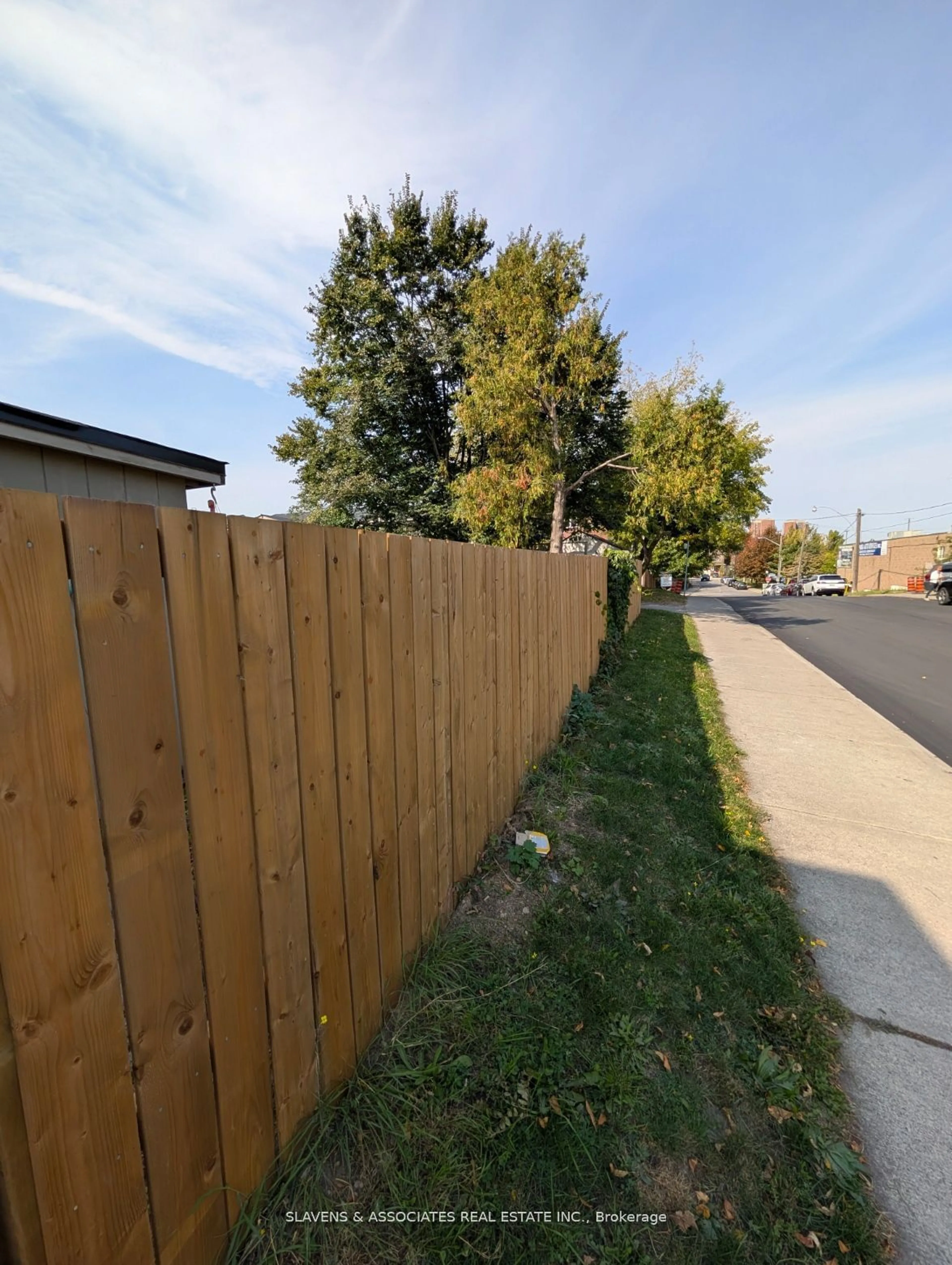 A pic from outside/outdoor area/front of a property/back of a property/a pic from drone, street for 2398 Gerrard St, Toronto Ontario M4E 2E1