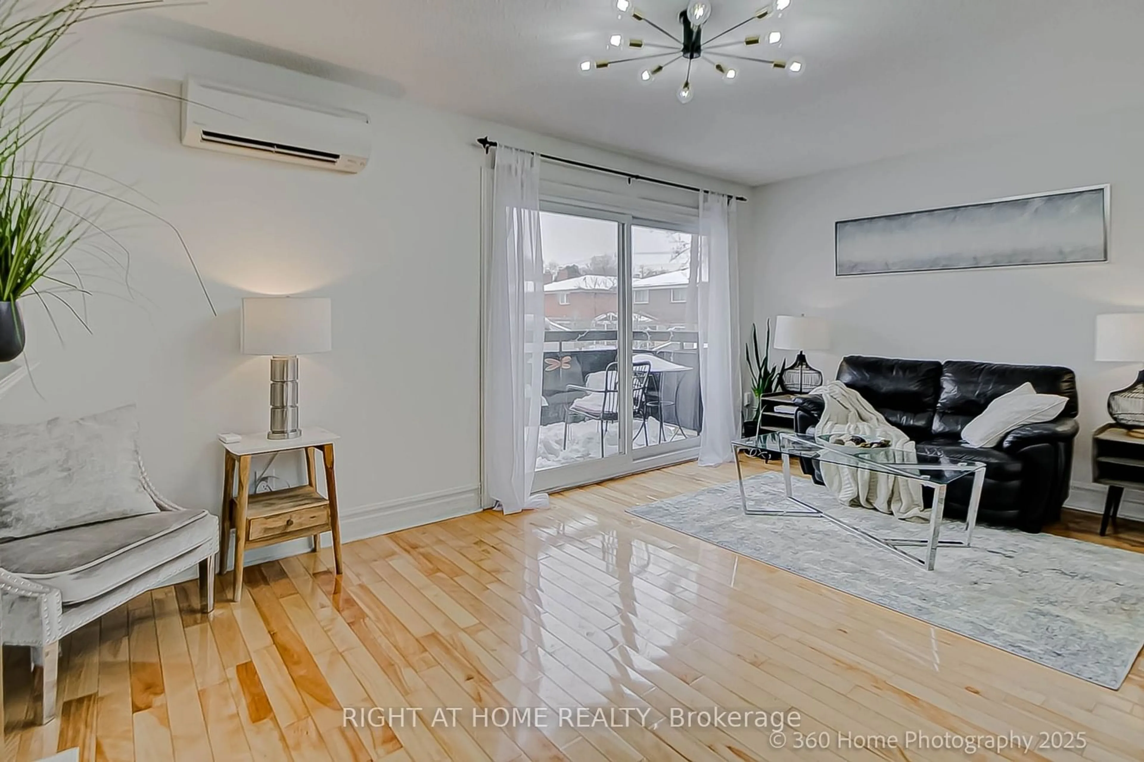 Living room with furniture, wood/laminate floor for 2020 Pharmacy Ave #8, Toronto Ontario M1T 1H8