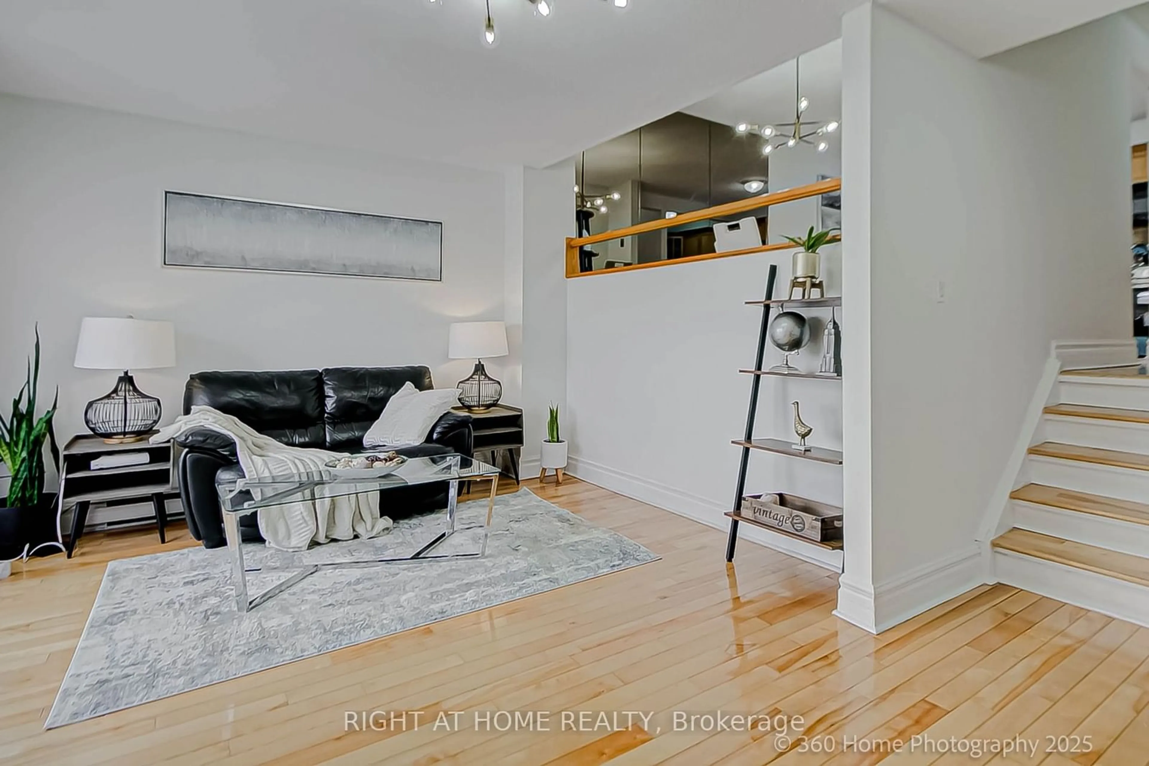 Living room with furniture, wood/laminate floor for 2020 Pharmacy Ave #8, Toronto Ontario M1T 1H8