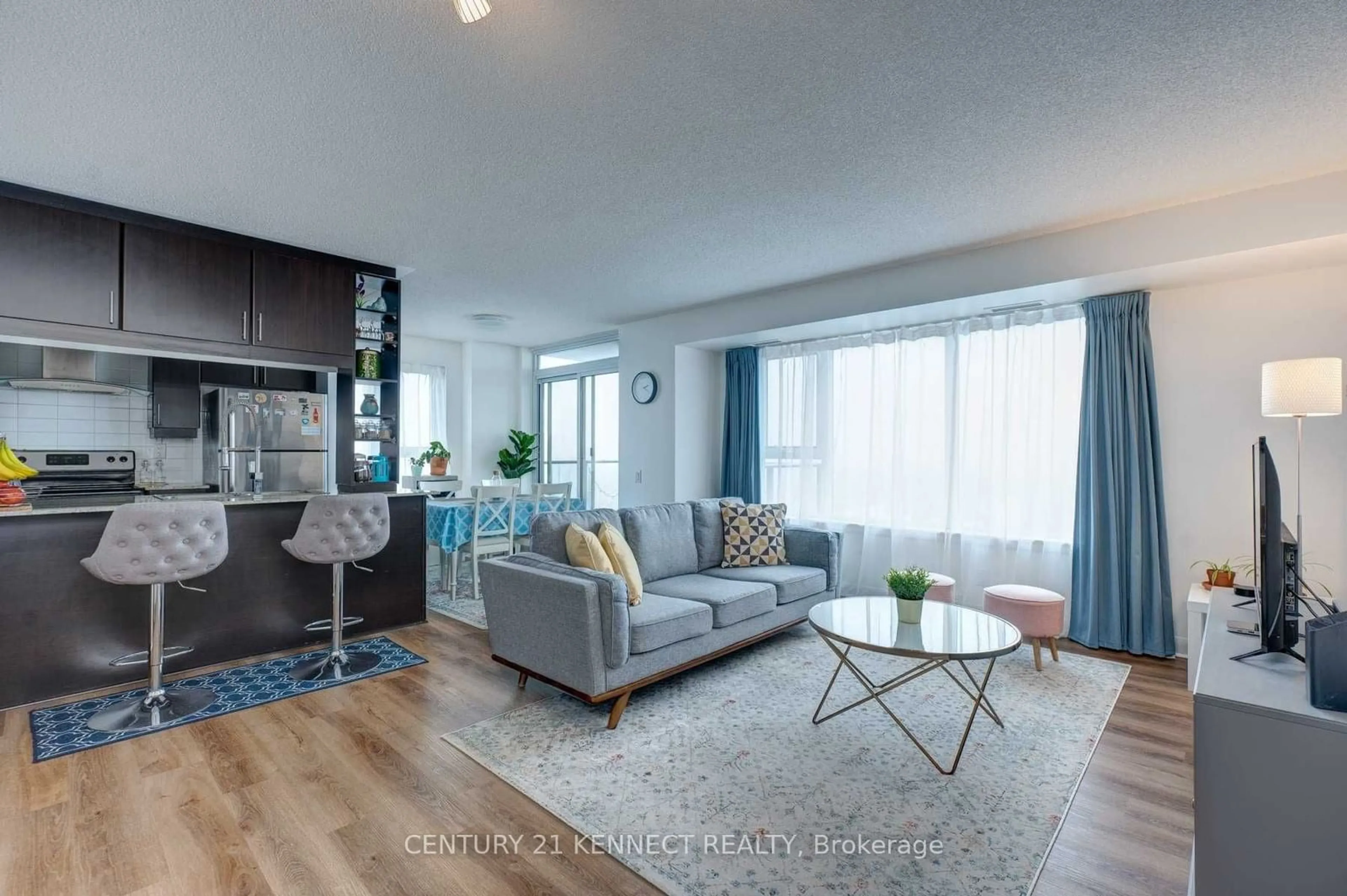 Living room with furniture, wood/laminate floor for 190 Borough Dr #2508, Toronto Ontario M1P 0B6